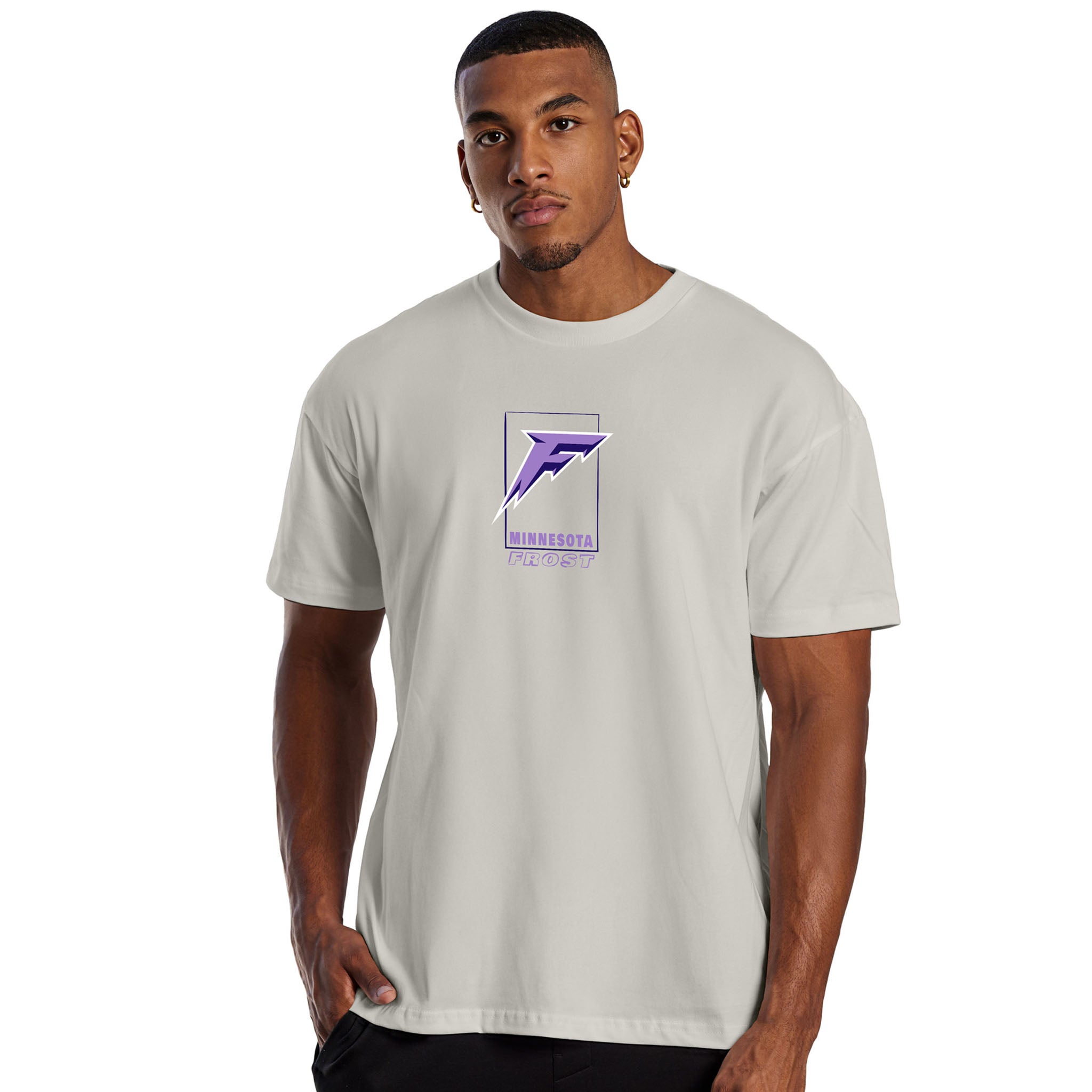 Man wearing a light gray t-shirt with a logo on a white background