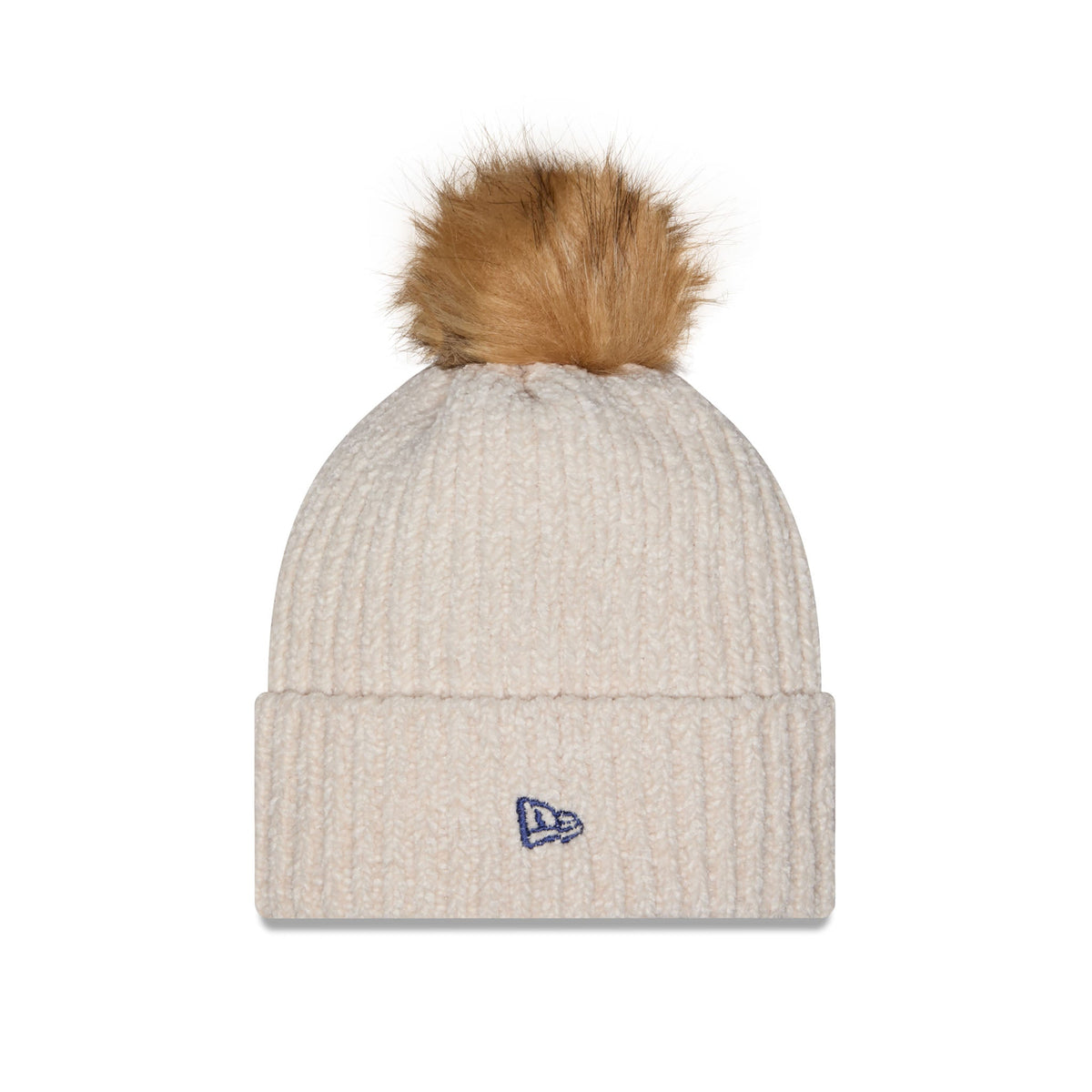 A ribbed knit beanie hat in a light oatmeal beige color, featuring a fluffy tan-brown pom-pom on top and a small blue embroidered New Era logo on the front cuff.