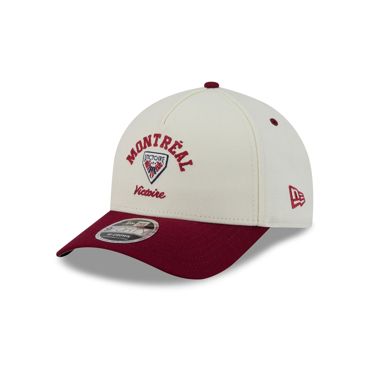 A New Era baseball cap in off-white and burgundy, featuring 'MONTREAL Victoire' embroidered on the front with the Montreal Canadiens logo, and a New Era flag logo on the side.