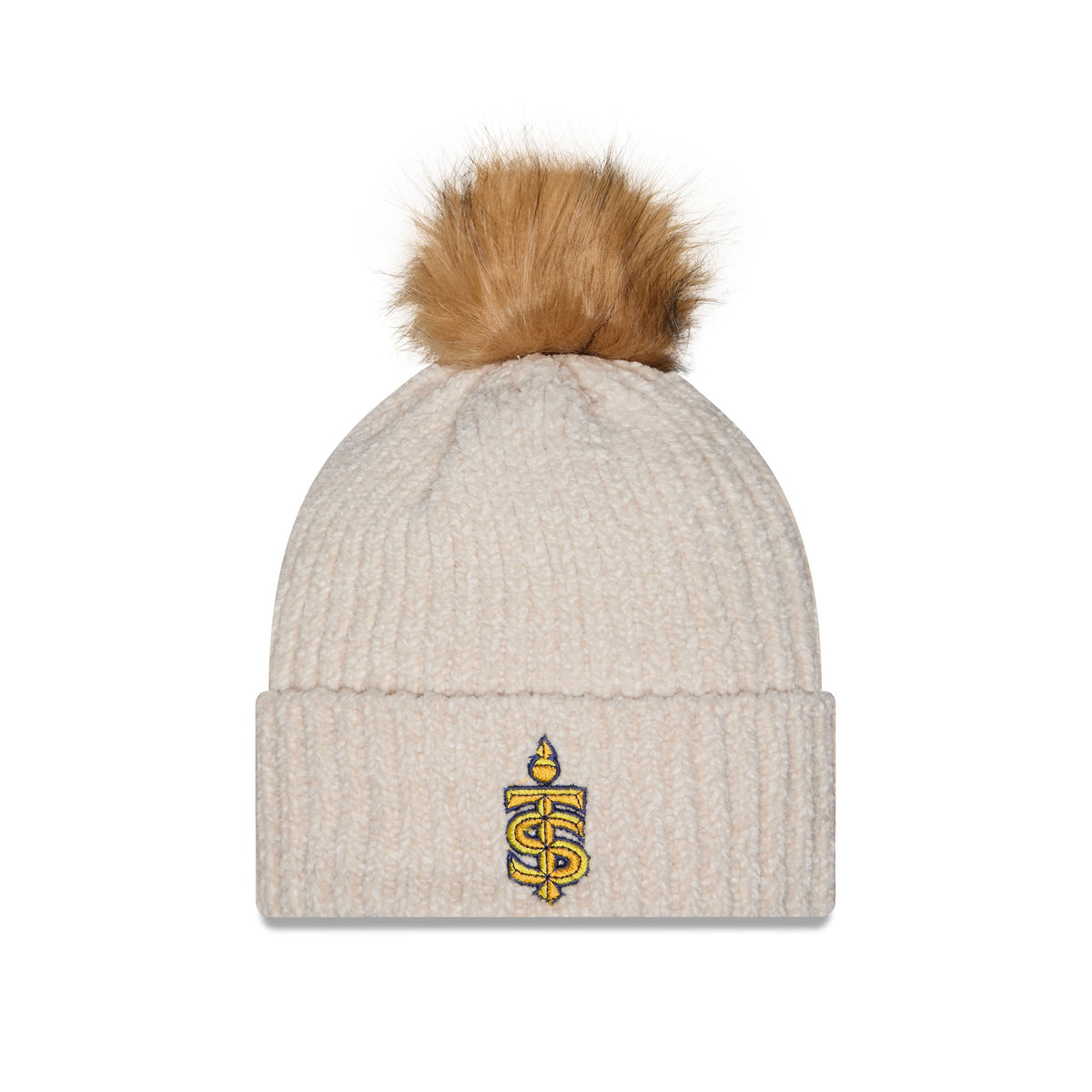 A ribbed knit pom-pom beanie in a light oatmeal beige color, featuring a small embroidered gold and black monogram logo on the front cuff. The beanie is topped with a fluffy tan faux-fur pom-pom and is photographed against a clean white background.