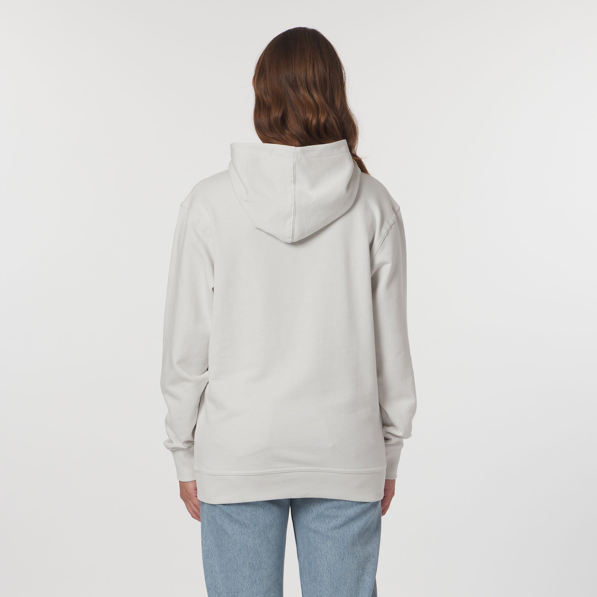Person wearing a light gray hoodie on a white background