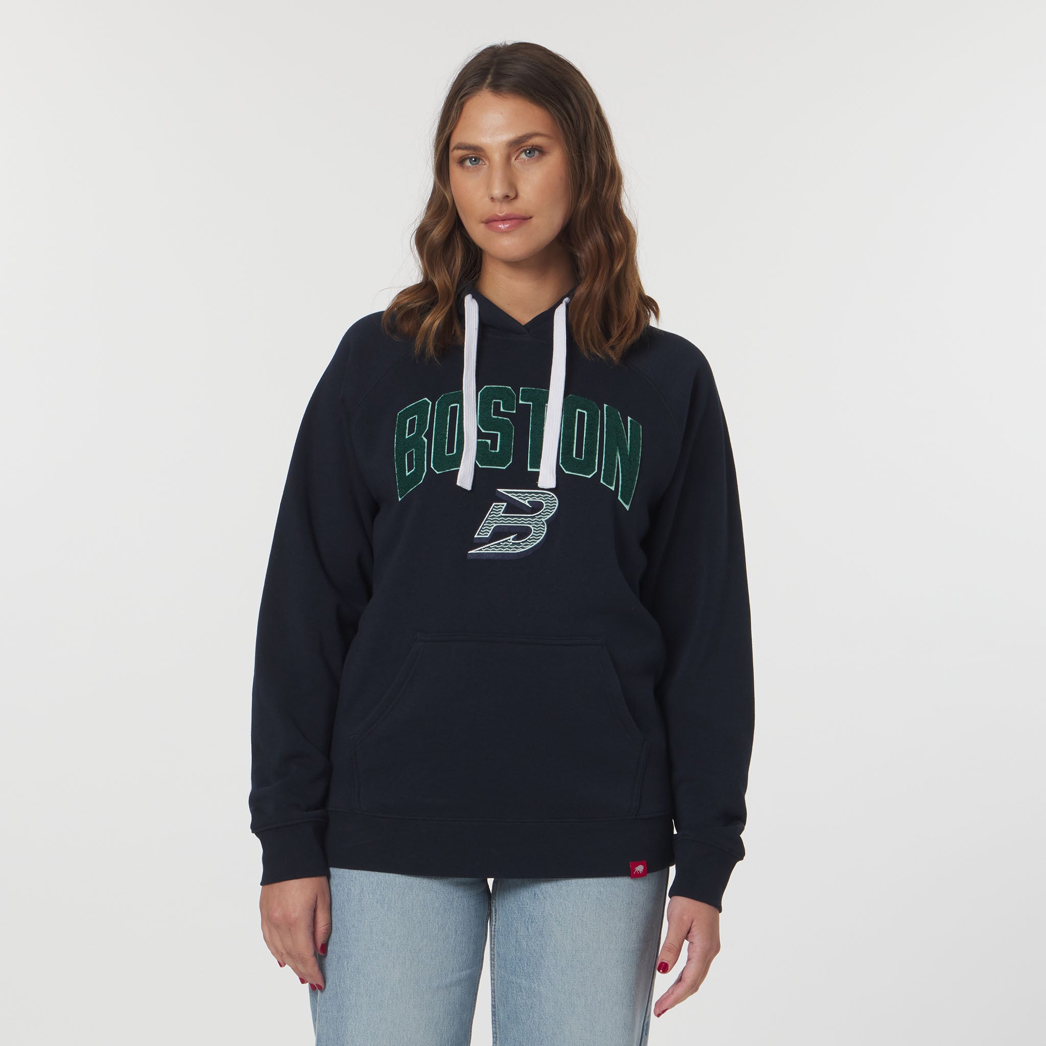 Woman wearing a navy hoodie with 'Boston' text on a white background