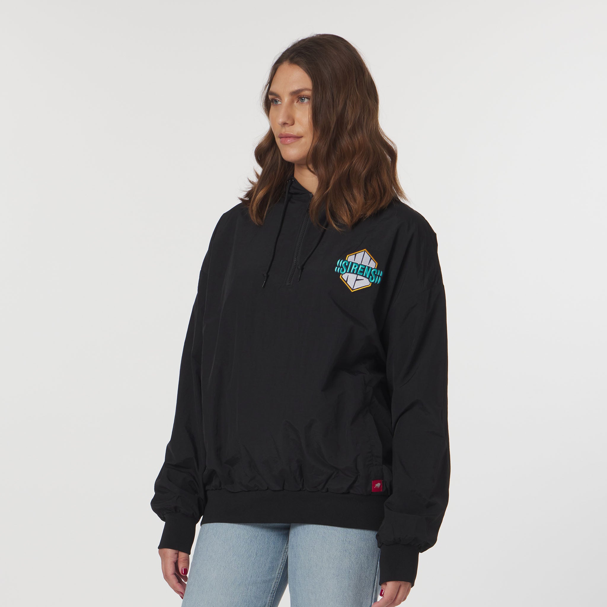 Person wearing a black hoodie with a logo on a white background