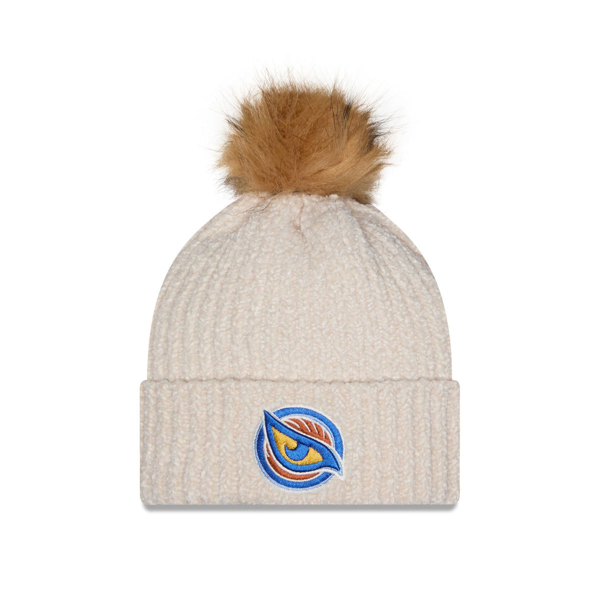 A ribbed knit beanie hat in a light cream or oatmeal color, topped with a fluffy tan faux-fur pom-pom. On the front cuff, there is an embroidered logo featuring a stylized eye in blue, orange, and yellow.