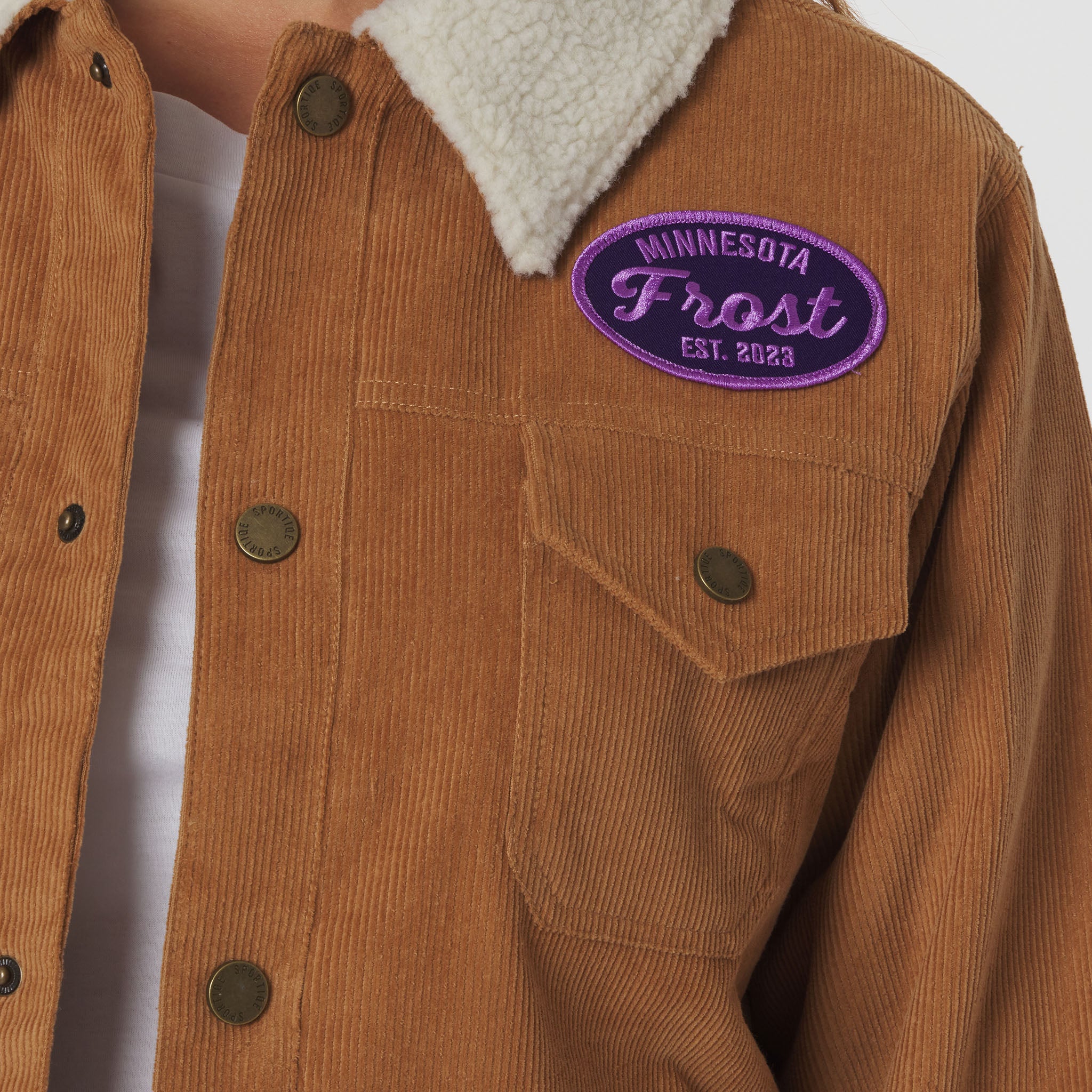 Brown jacket with a 'Minnesota Frost' patch on a white background