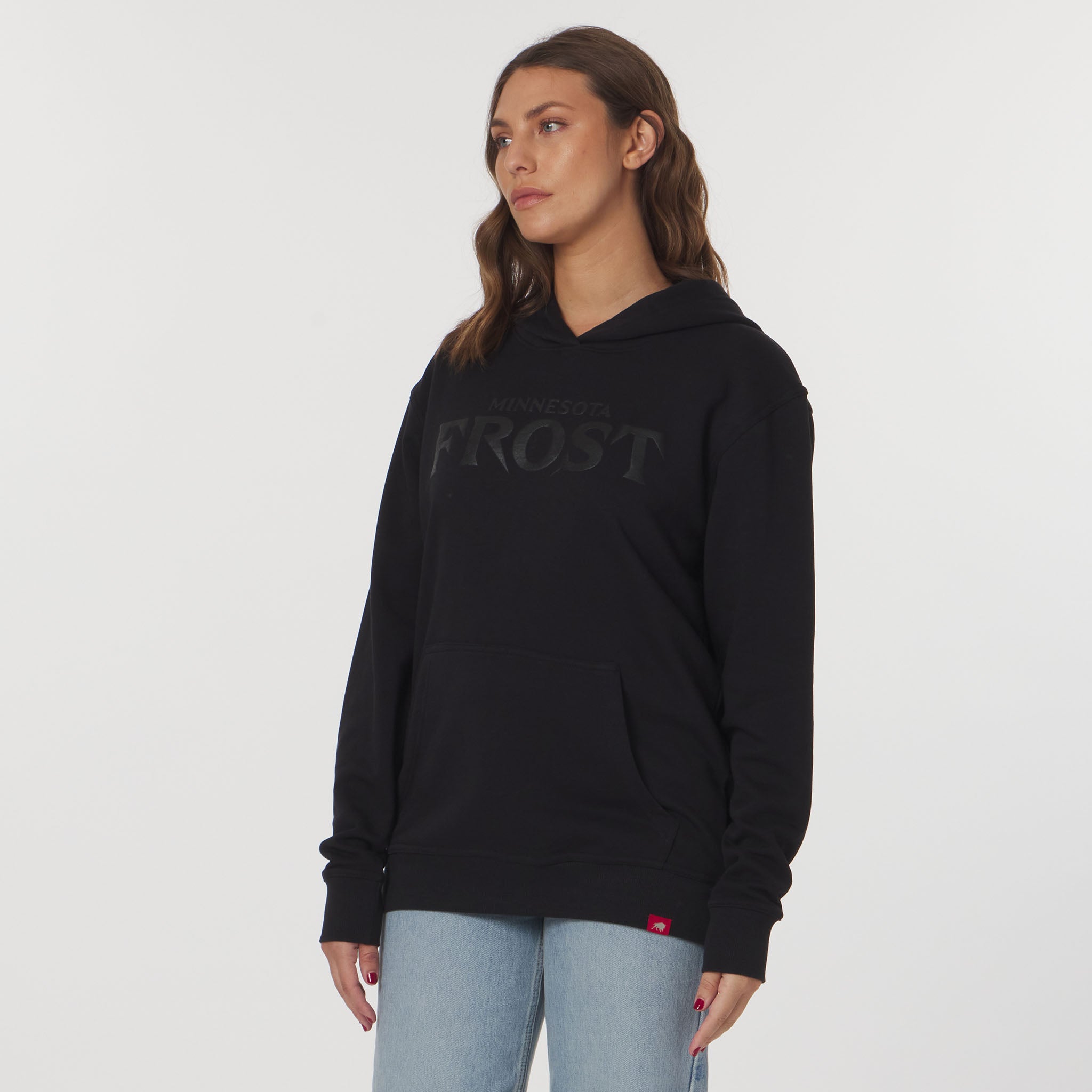 Woman wearing a black hoodie with 'Frost' branding on a white background