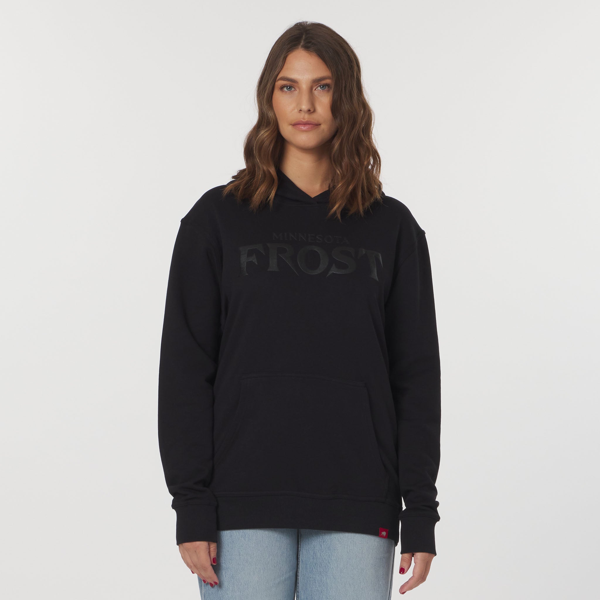 Person wearing a black hoodie with 'Frost' branding on a plain background