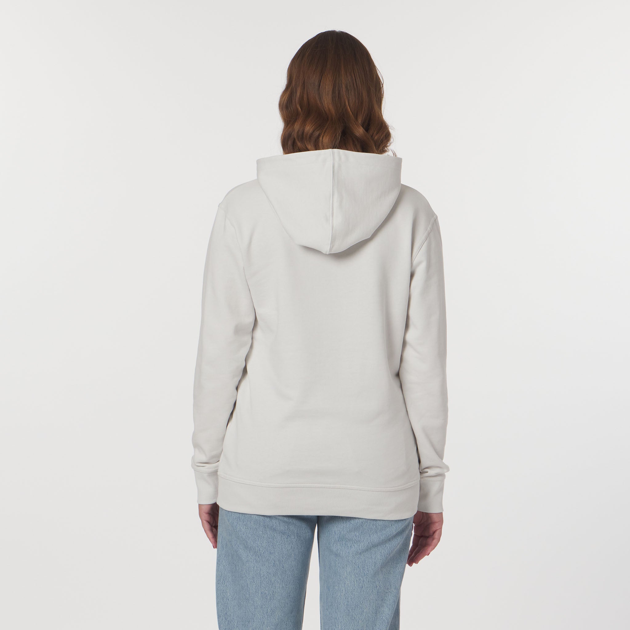 Person wearing a light gray hoodie on a white background