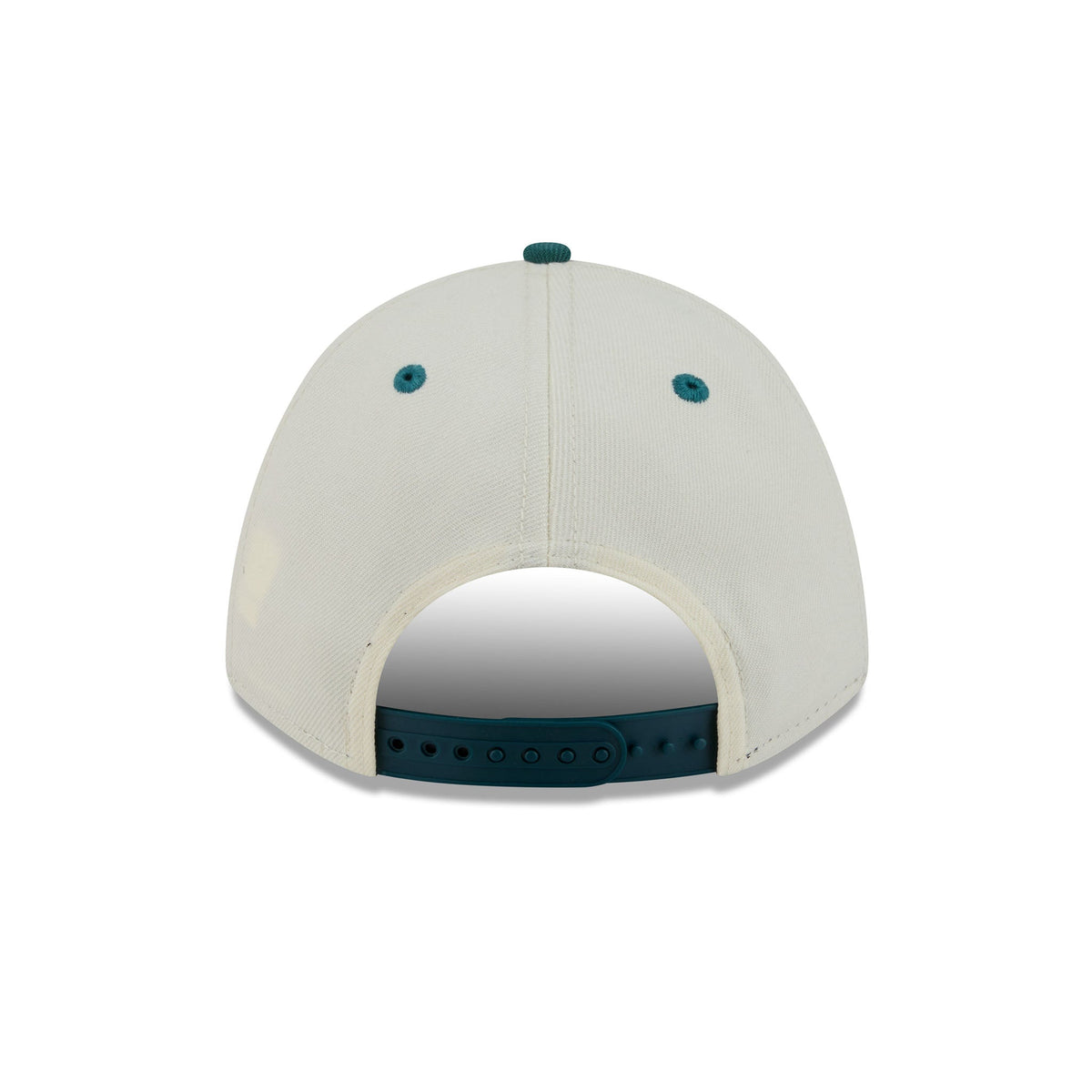 The back view of a structured baseball cap in off-white canvas with dark teal accents on the button, eyelets, and adjustable strap.