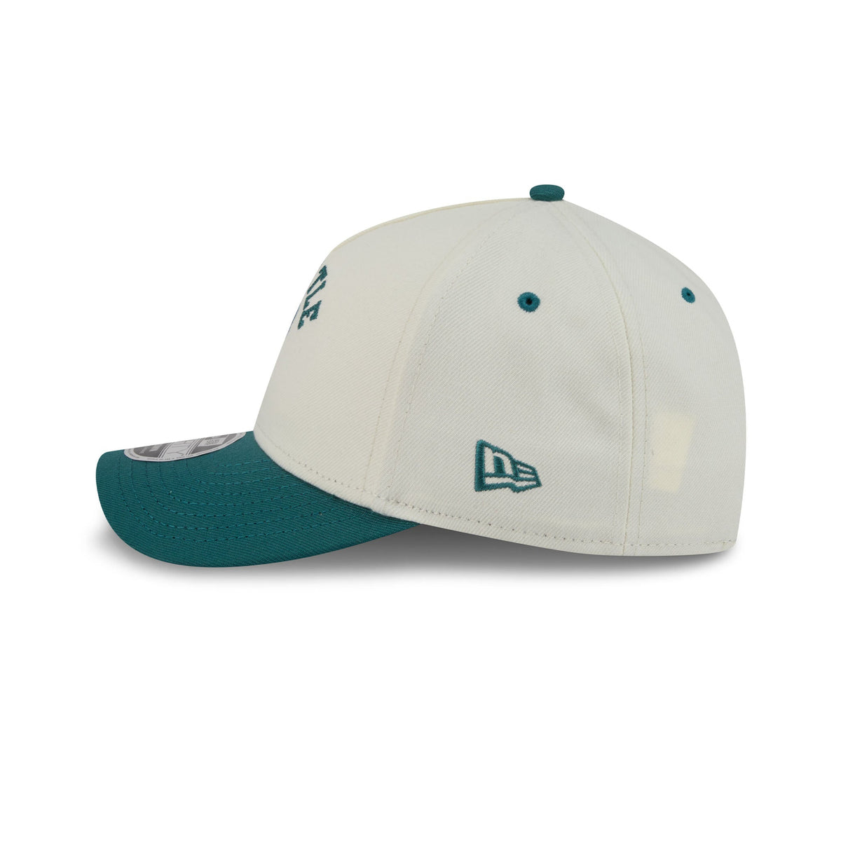 A structured baseball cap in off-white with a dark green visor, green button, and green embroidered New Era logo on the side.