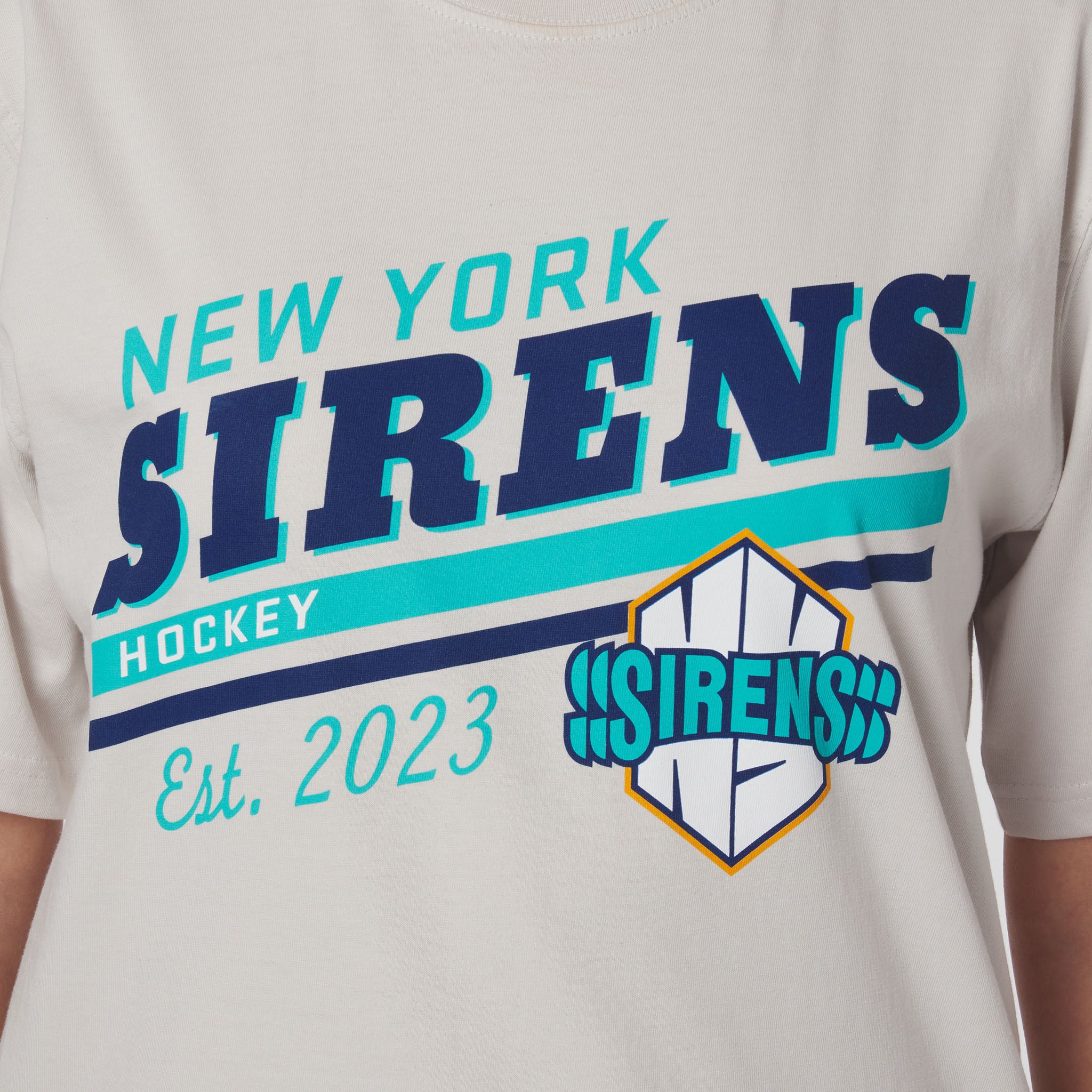 T-shirt with 'New York Sirens Hockey' text and logo on a light gray background