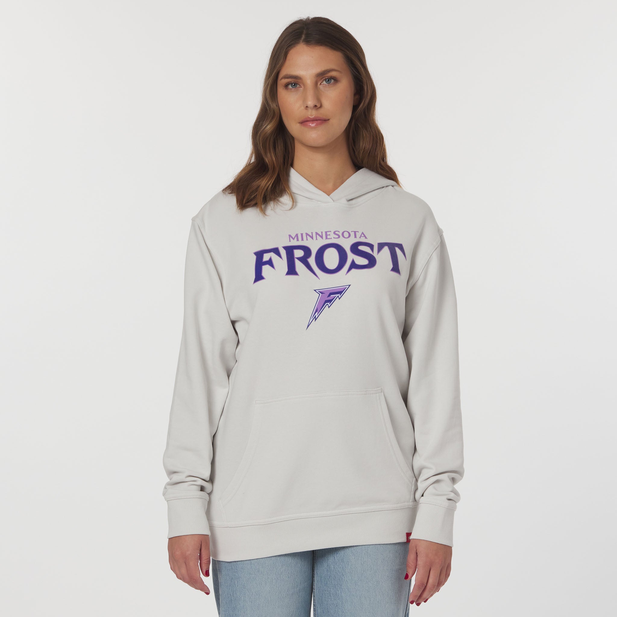 Person wearing a gray hoodie with 'Minnesota Frost' text on a white background
