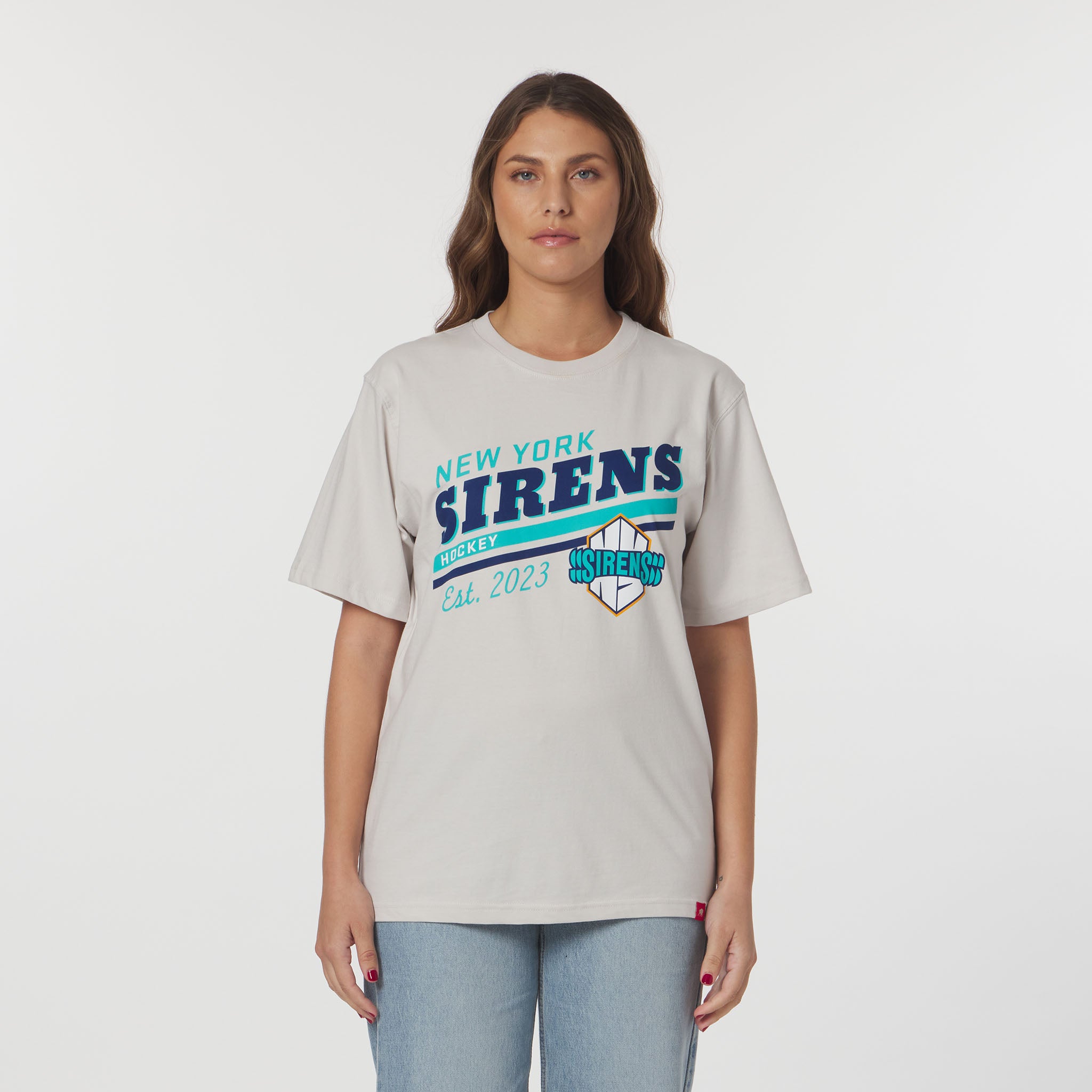 Woman wearing a gray t-shirt with 'New York Sirens' text on a white background