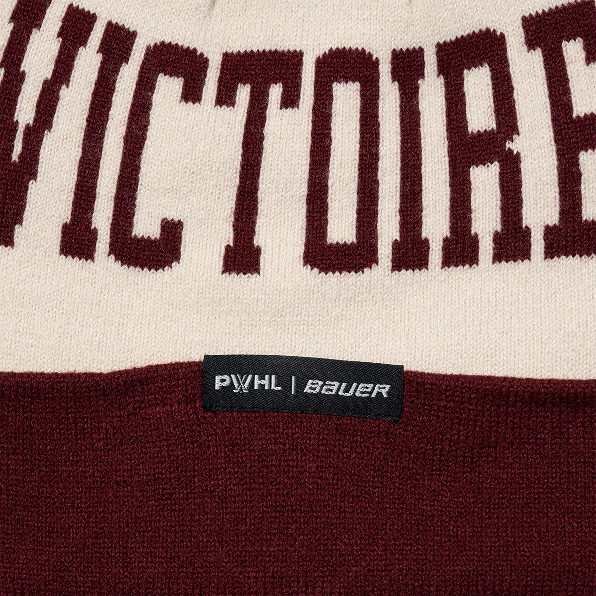 Maroon and beige sports sweater with 'VICTORIAS' text and PWHL Bauer label.