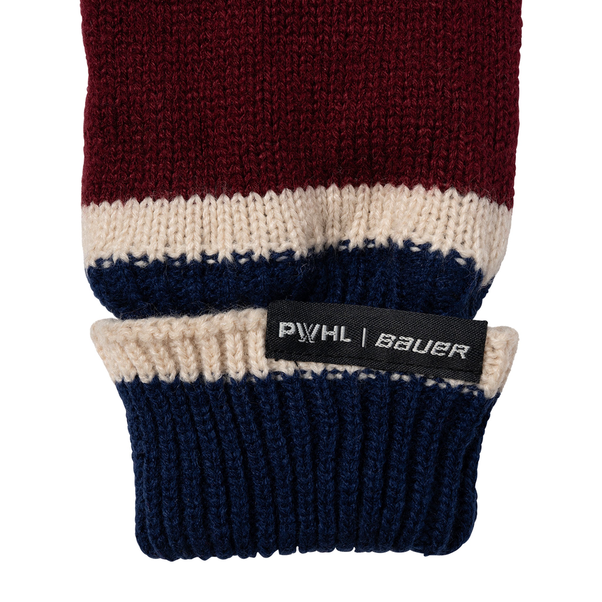 Close-up of a knitted sleeve with a PWHL Bauer label on a white background