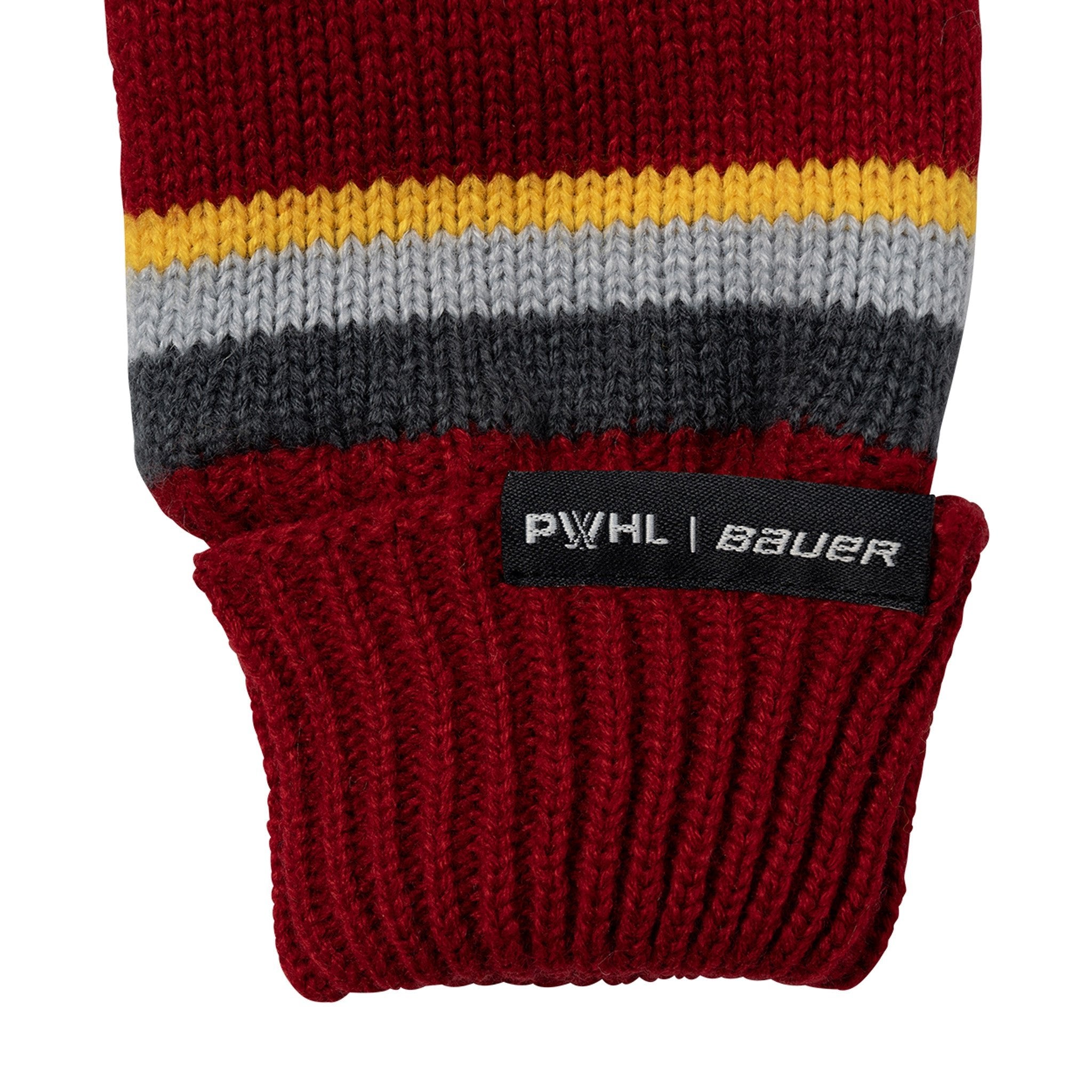 Close-up of a red knitted sleeve with multicolored stripes and a visible brand label on a white background.