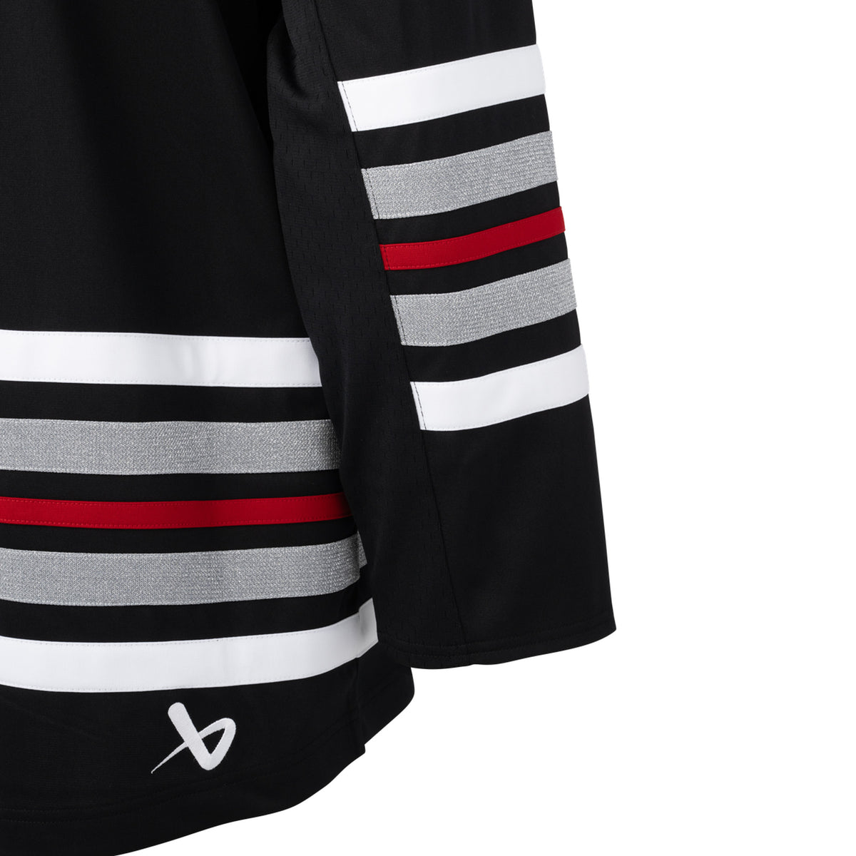 Back of a black jersey with red, white, and shimmering silver stripes on the sleeves and bottom hem. A white Bauer logo is above the bottom right hem.