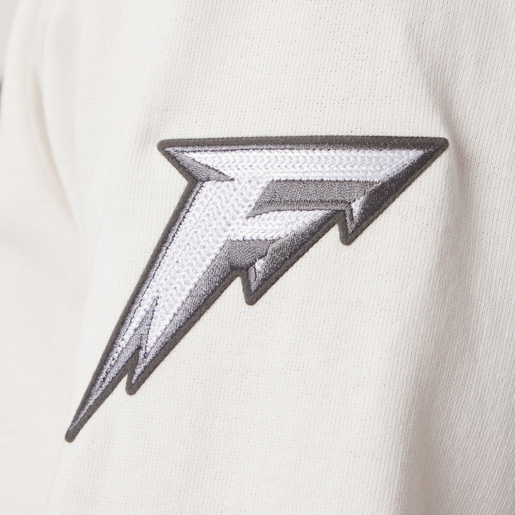 Black and white geometric patch on a white background