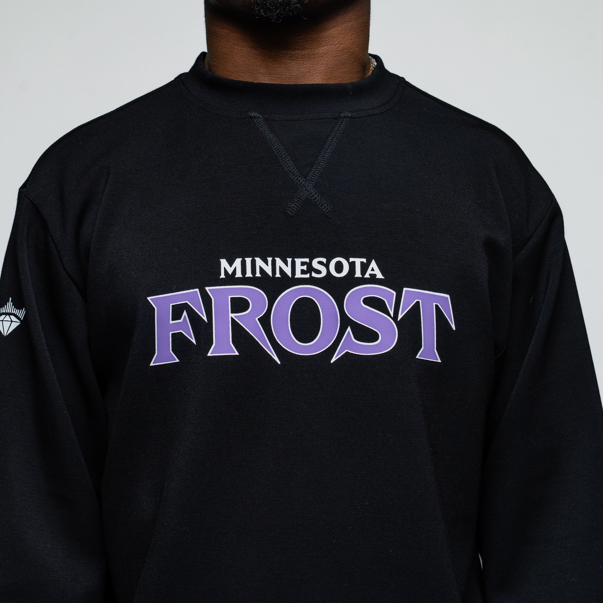 Black sweatshirt with 'Minnesota Frost' text on a plain background