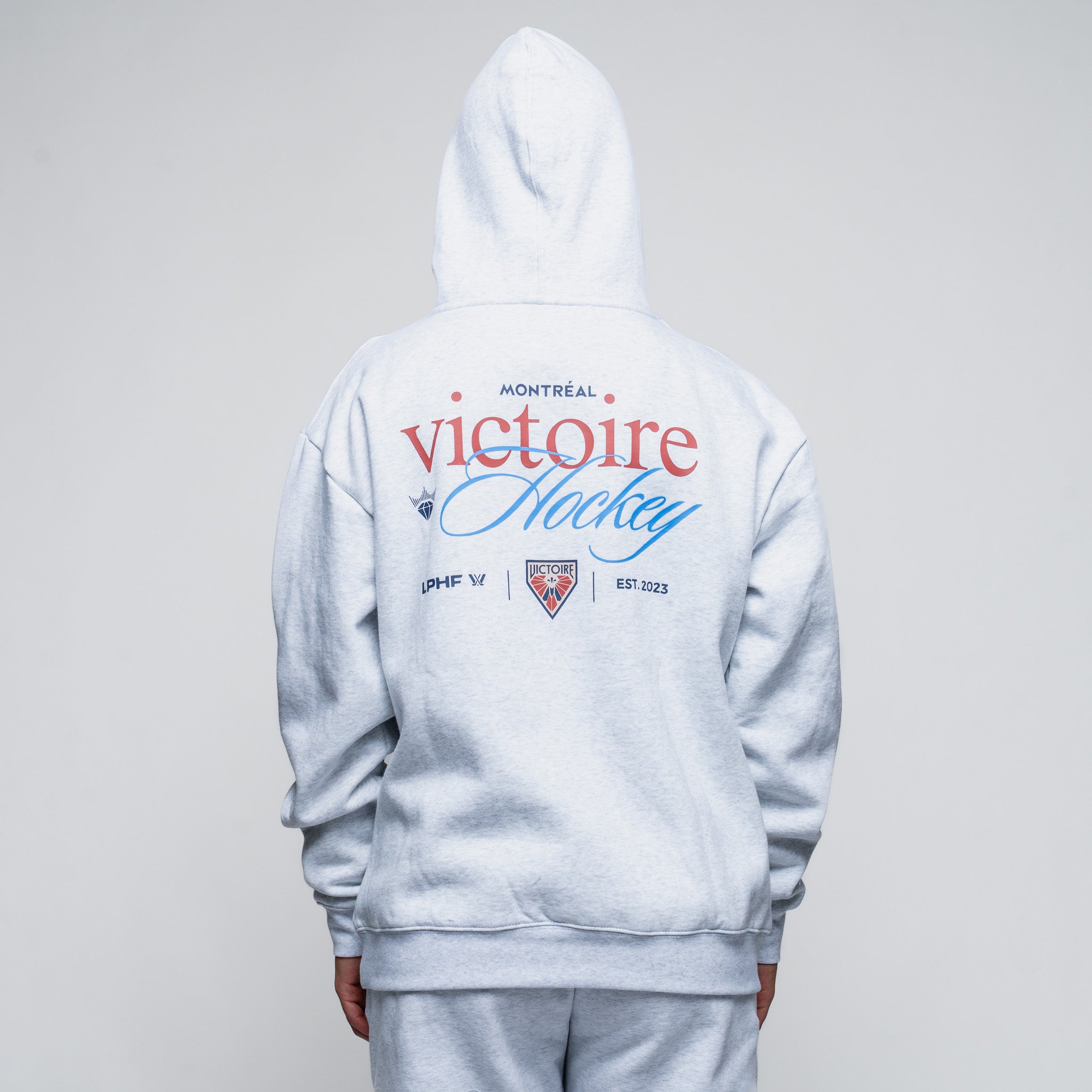 Gray hoodie with 'Montreal Victoire Hockey' text on the back against a gray background