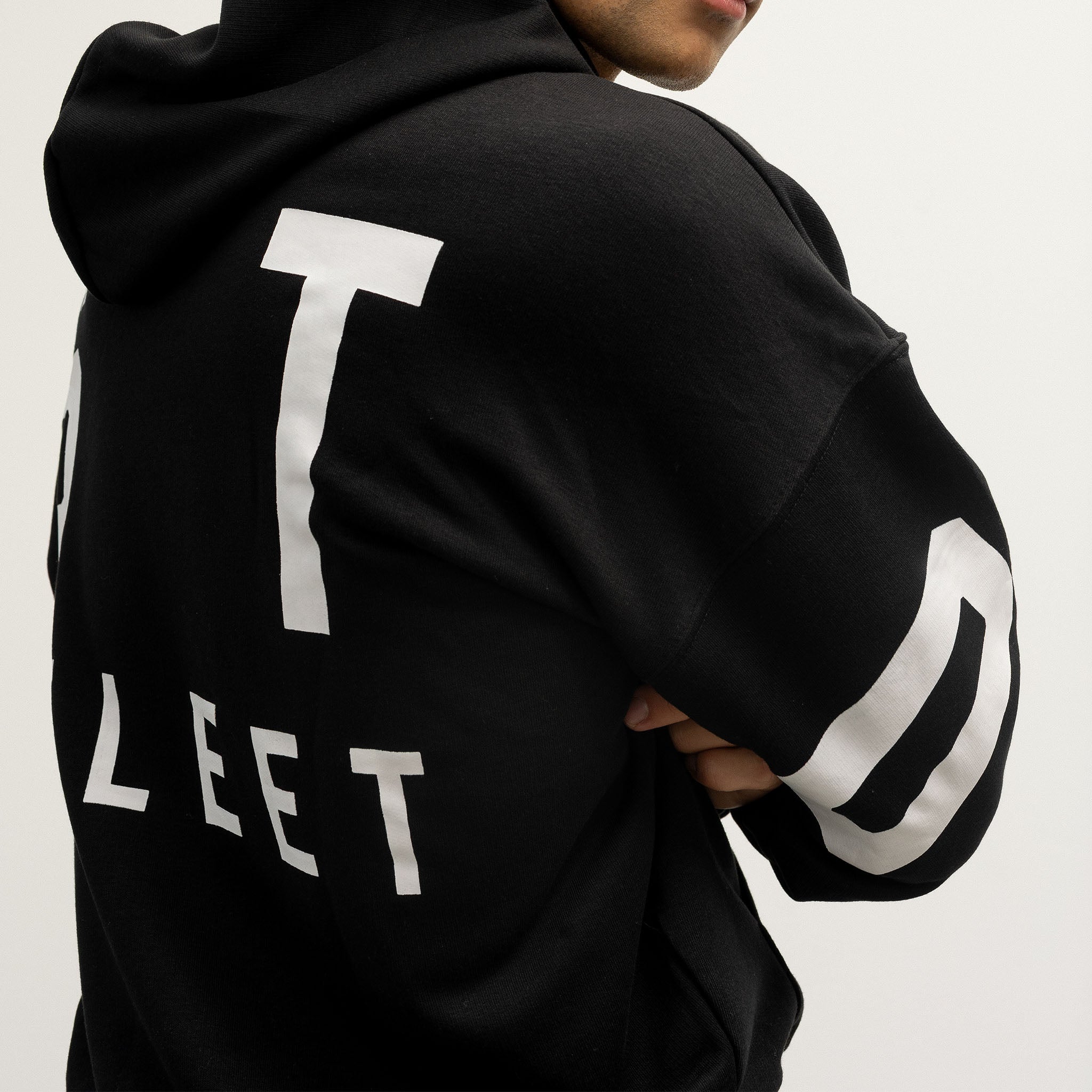 Black hoodie with white Boston Fleet text and stripes on a plain background