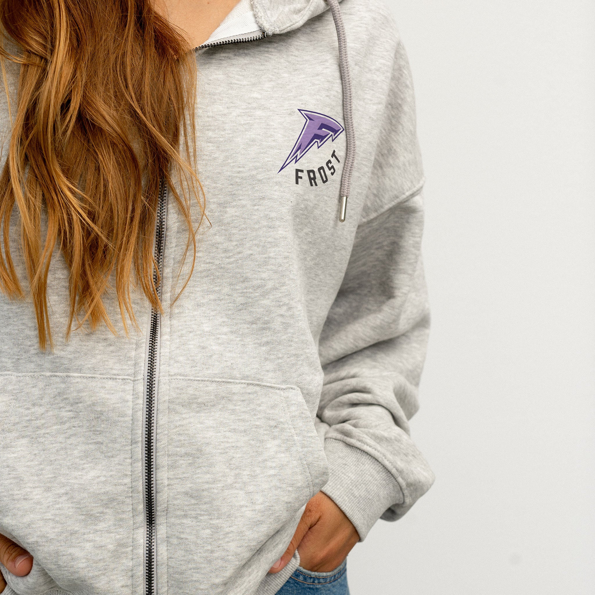 person wearing the Minnesota Frost grey zip-up hoodie