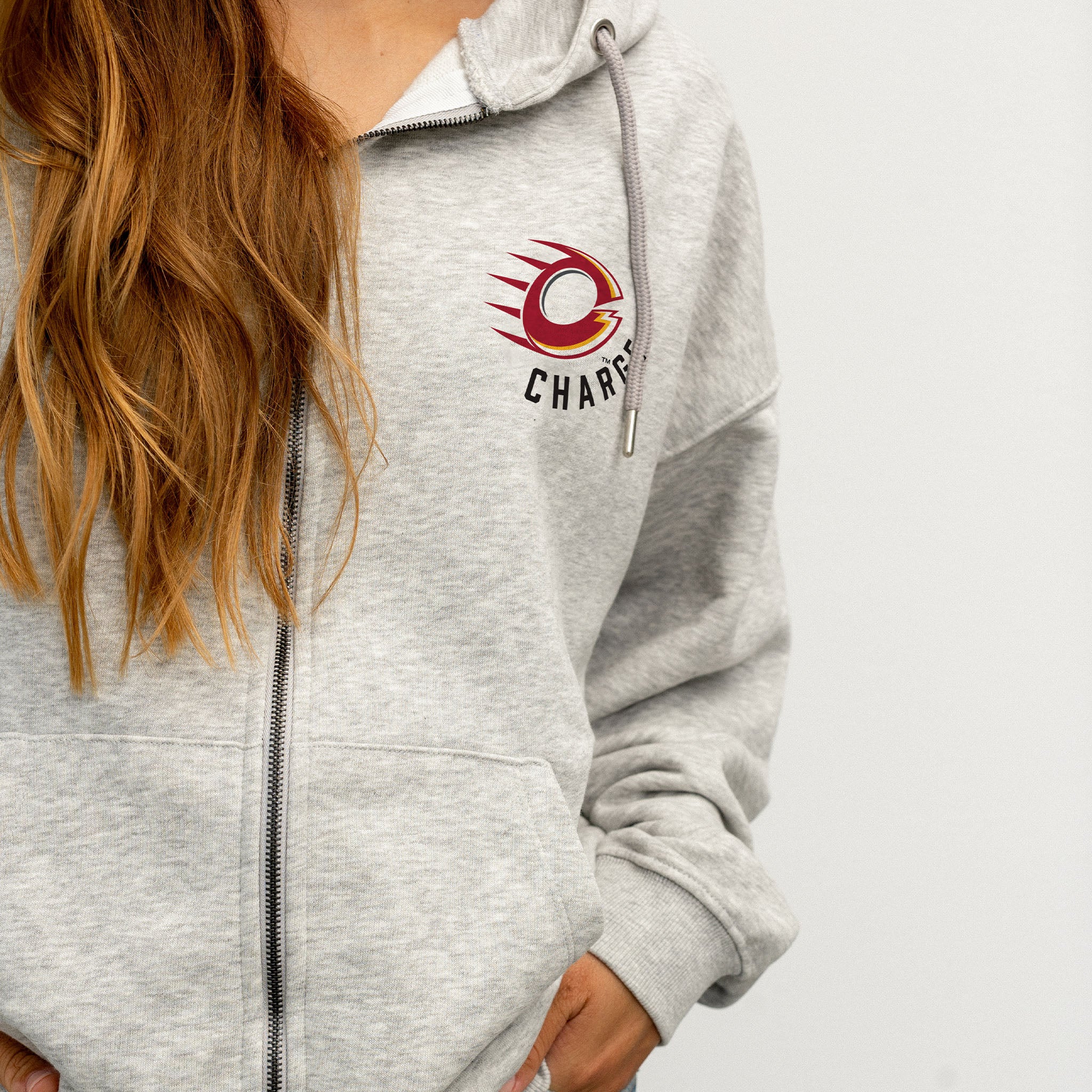 person wearing the Ottawa Charge grey zip-up hoodie