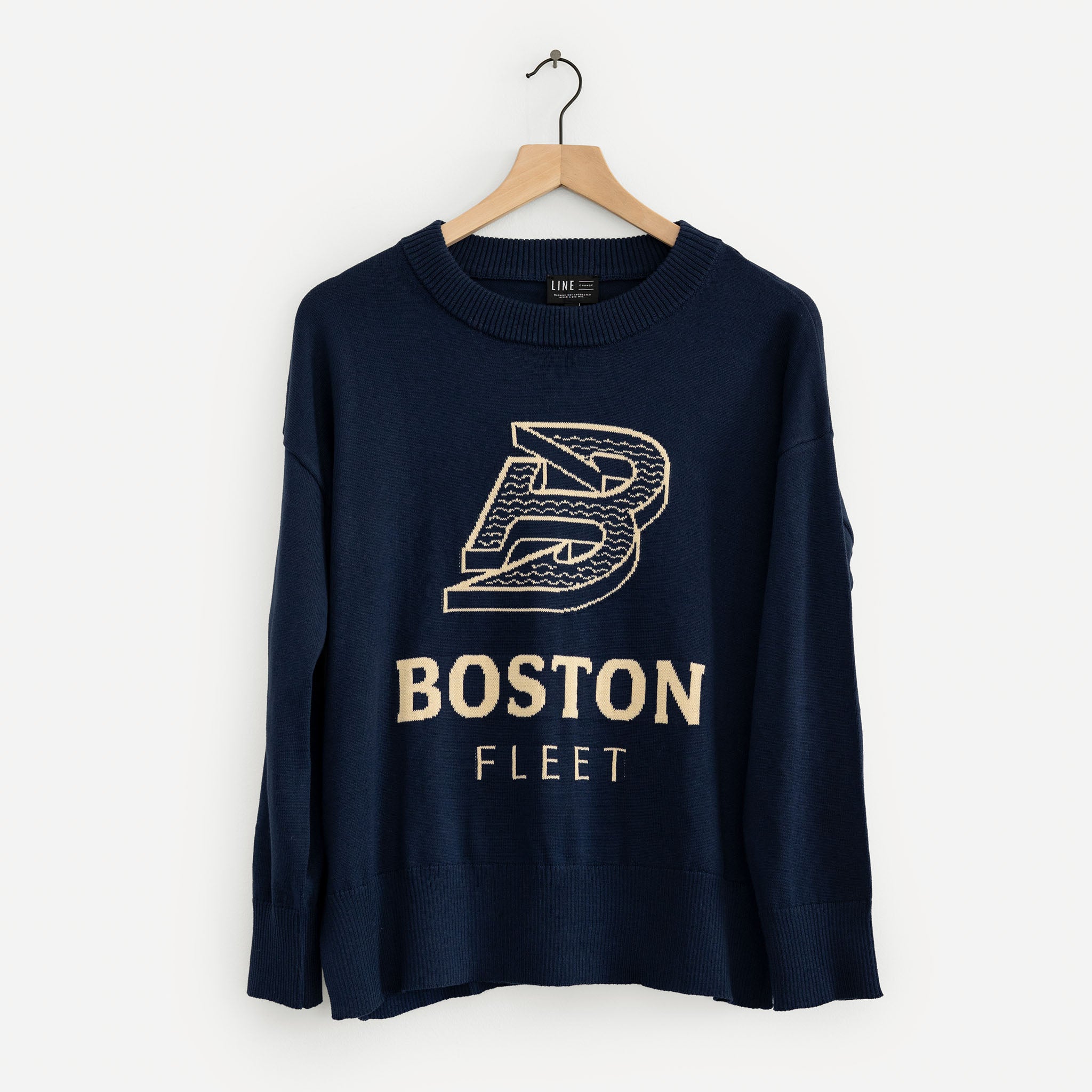 Navy blue sweatshirt with 'Boston Fleet' text and logo on a hanger against a white background