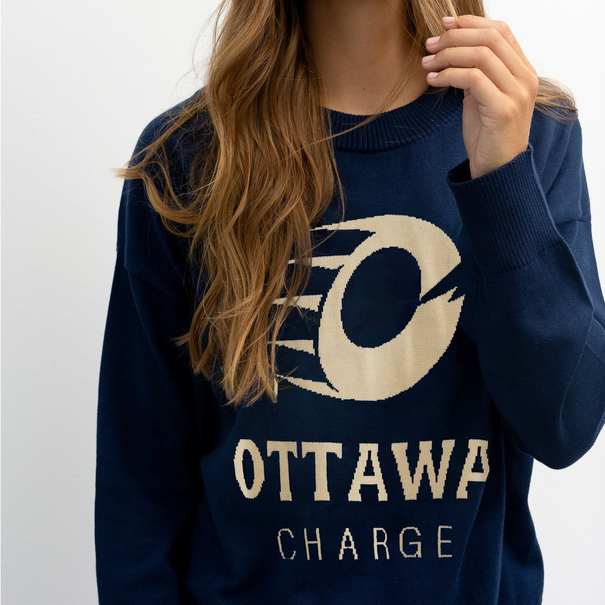 Navy blue sweater with 'Ottawa Charge' text and logo on a plain background