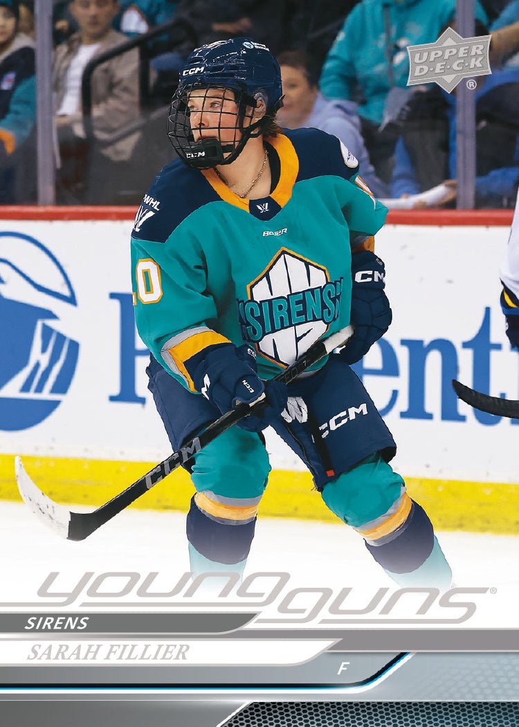 Hockey player in a green uniform with 'Sirens' on the jersey, holding a hockey stick on an ice rink.