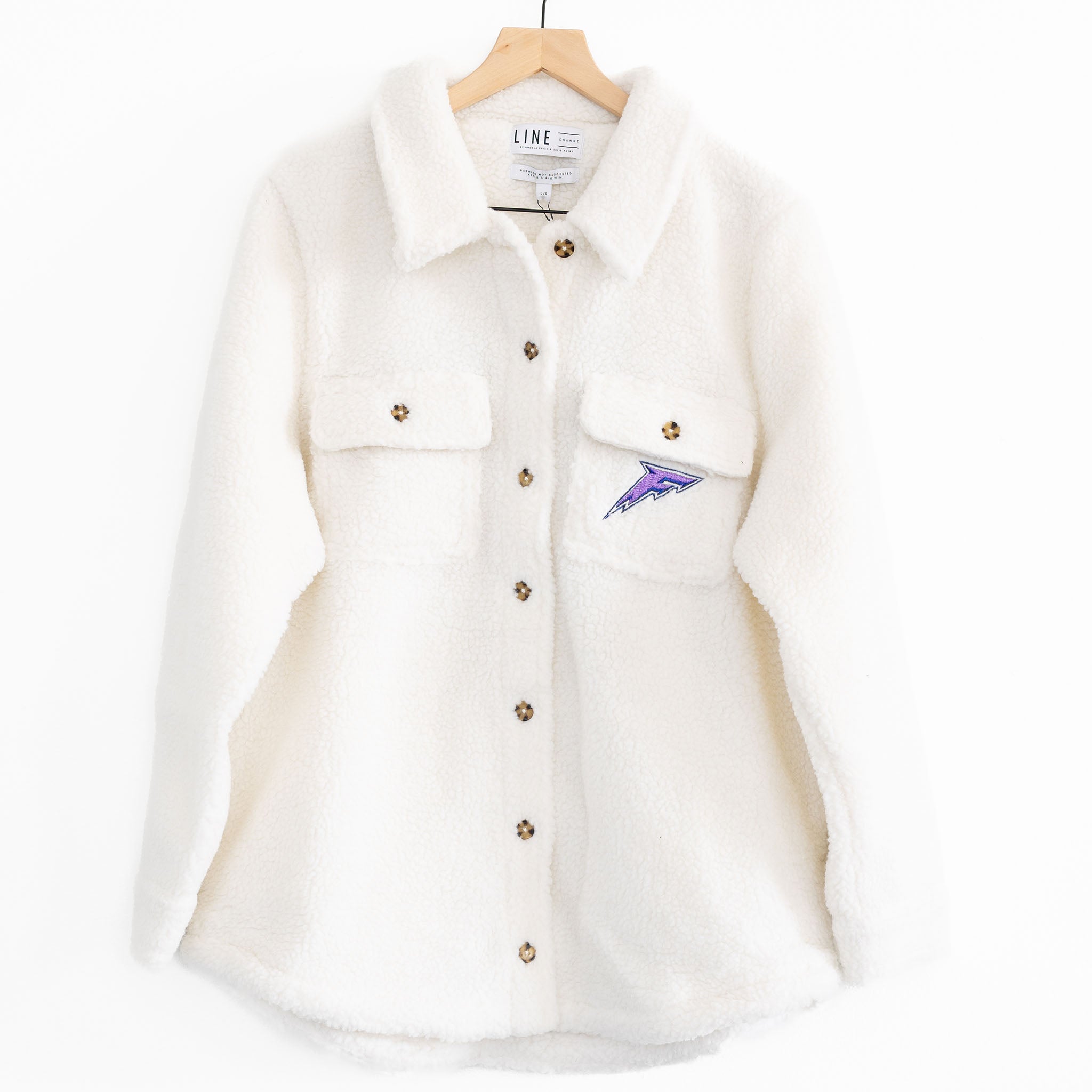 The front of a white sherpa jacket with the Minnesota Frost logo on the pocket