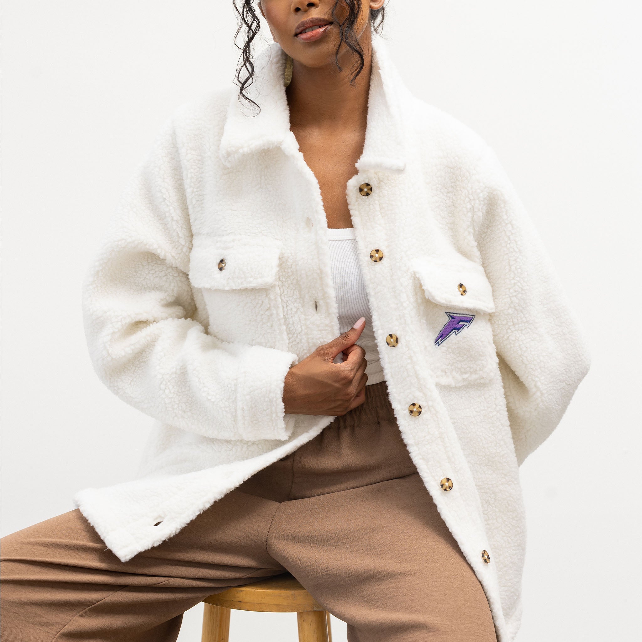 person wearing the Minnesota Frost white sherpa jacket