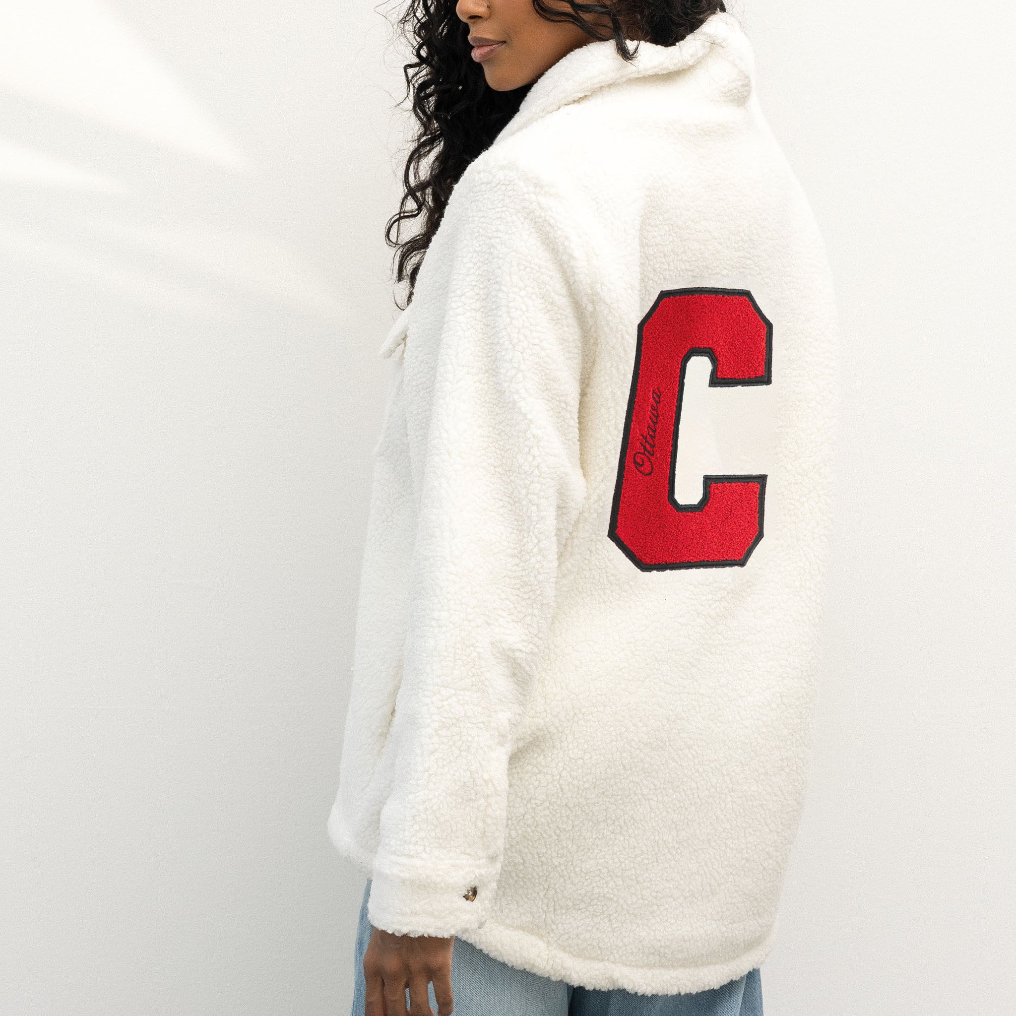 person wearing the Ottawa Charge white sherpa jacket