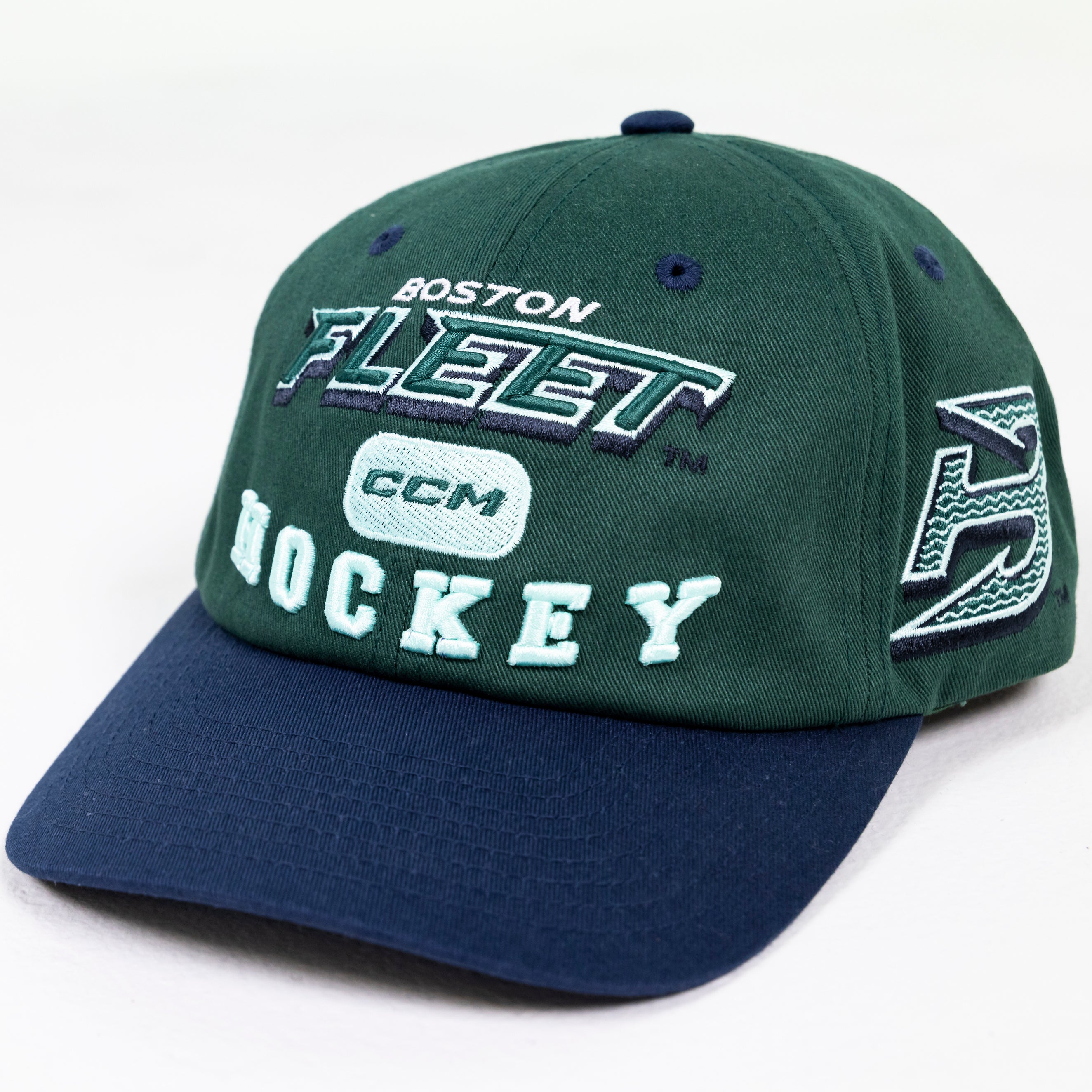 Green and navy blue cap with 'Boston Fleet Hockey' and CCM logo on a white background