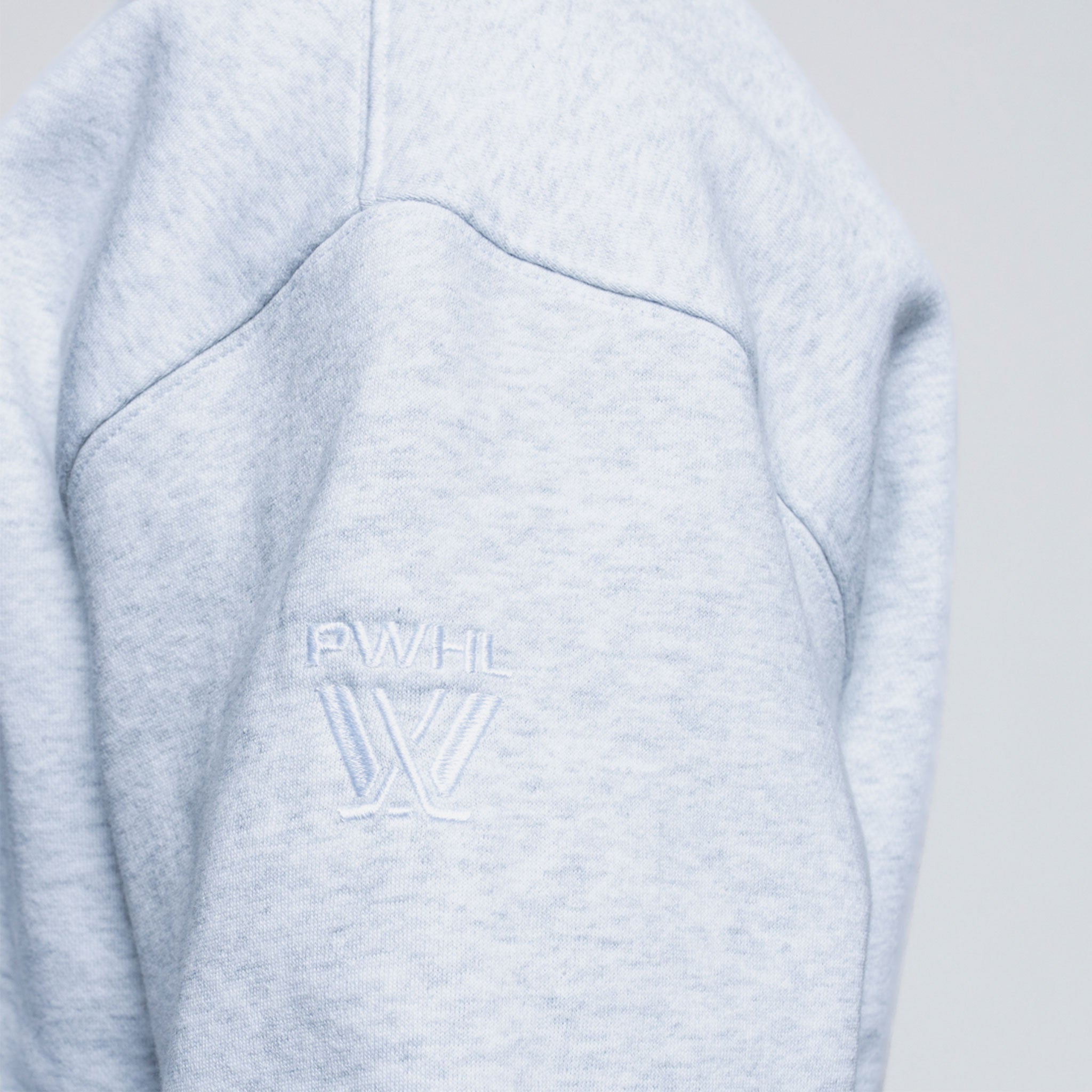 Light grey embroidered wordmark on grey sweater