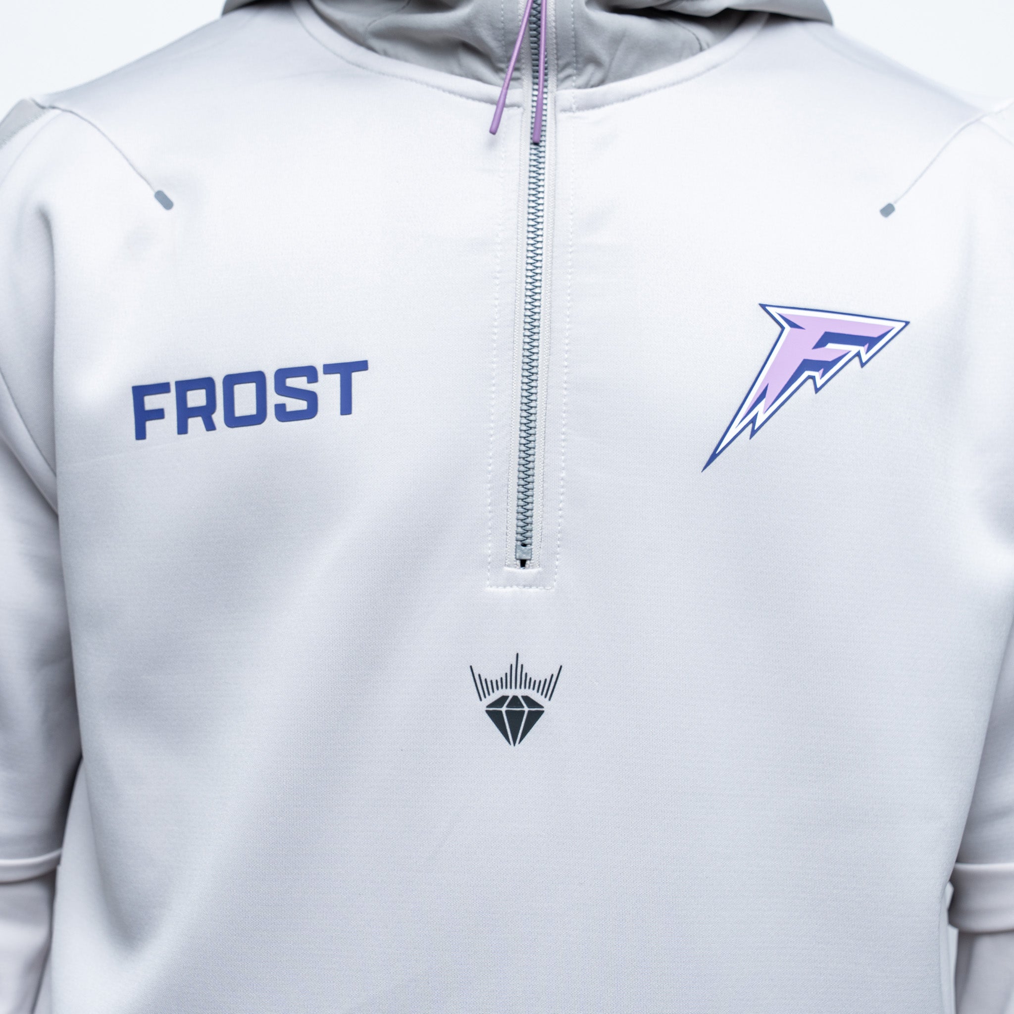 Gray jacket with 'Frost' branding and logos on a white background