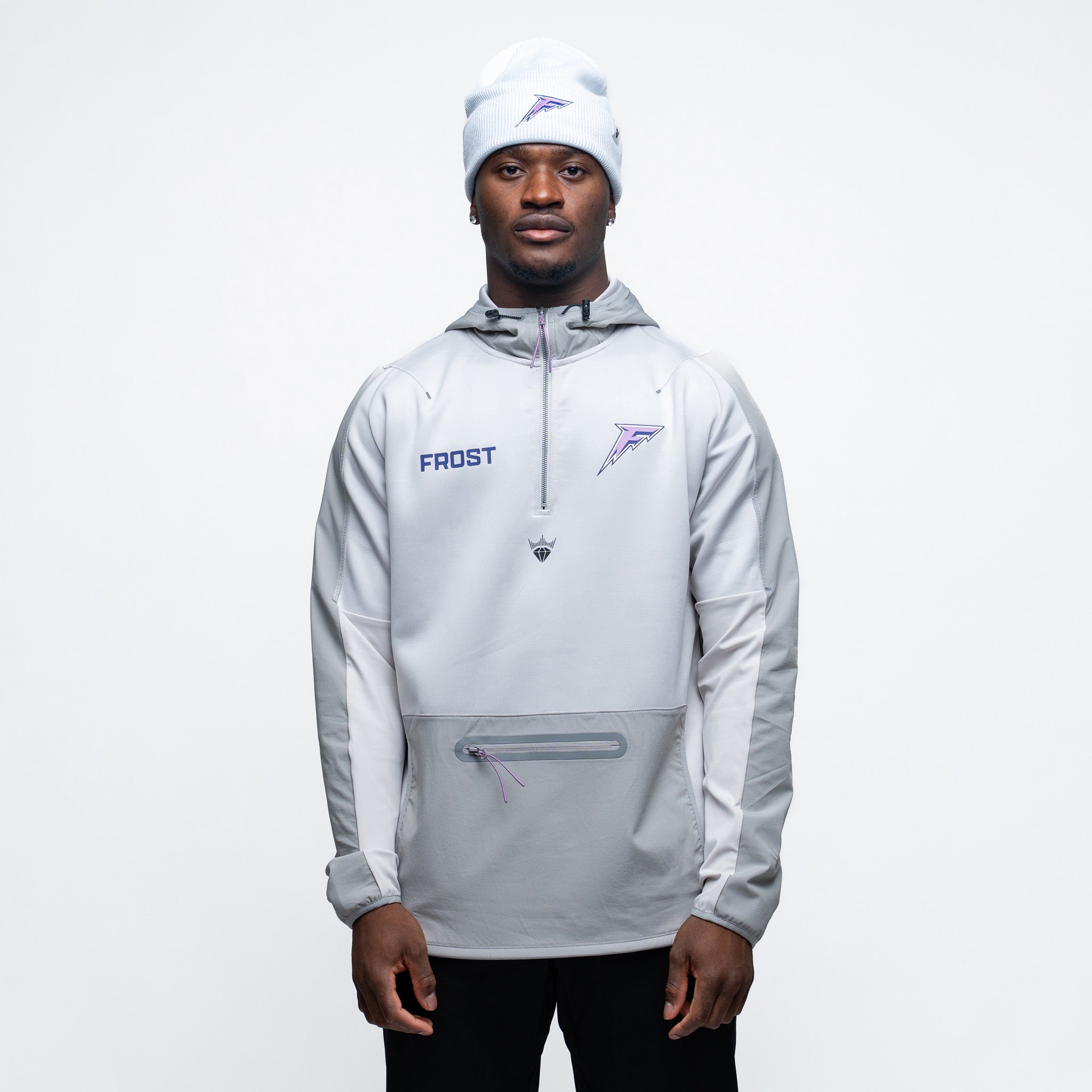 Person wearing a light gray jacket with 'Frost' branding on a white background