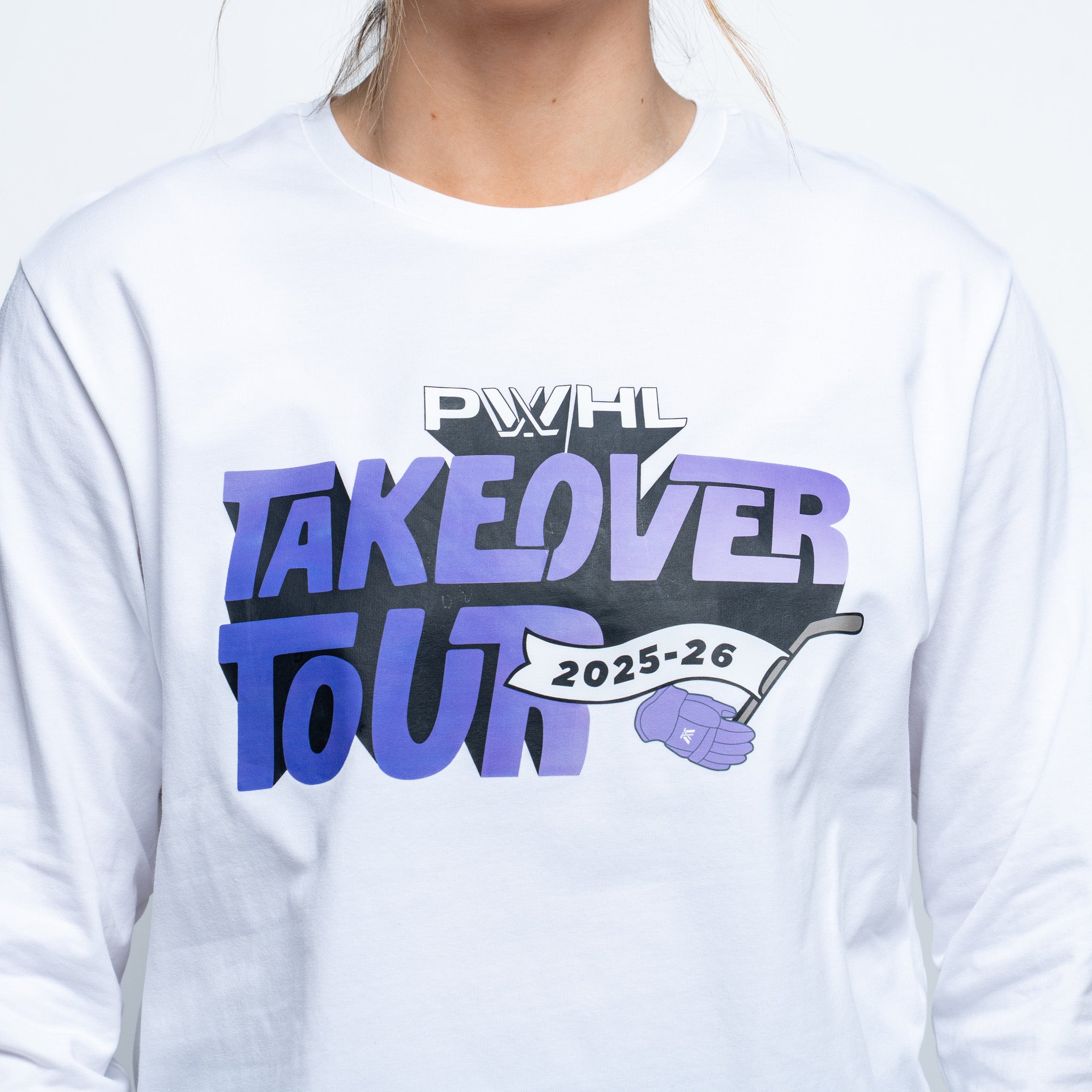 White long-sleeve shirt with 'PWHL Takeover Tour 2025-26' text and graphic on a white background