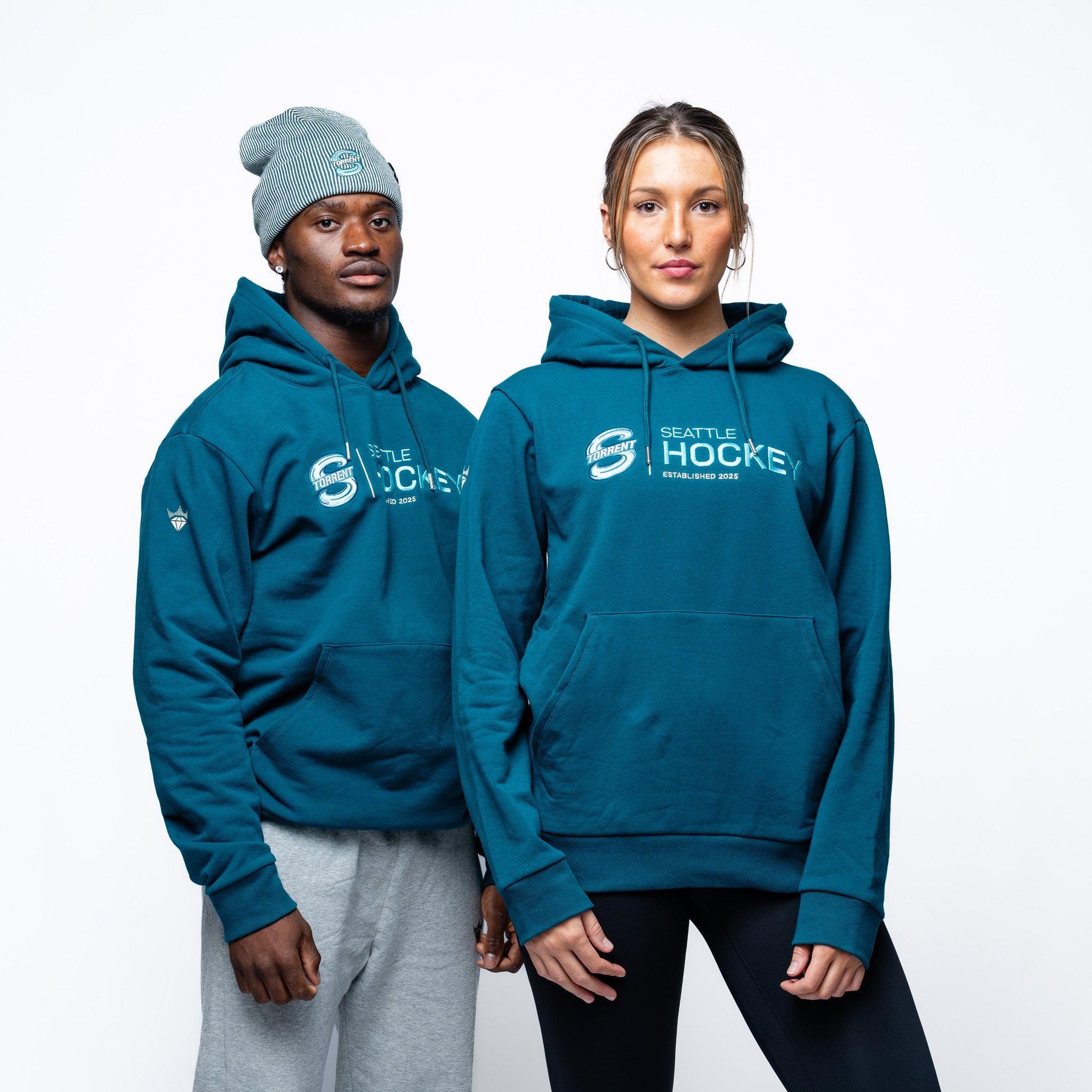 Man and woman wearing the green Adult Seattle Torrent Royalty Citymark Cloud Hoodie