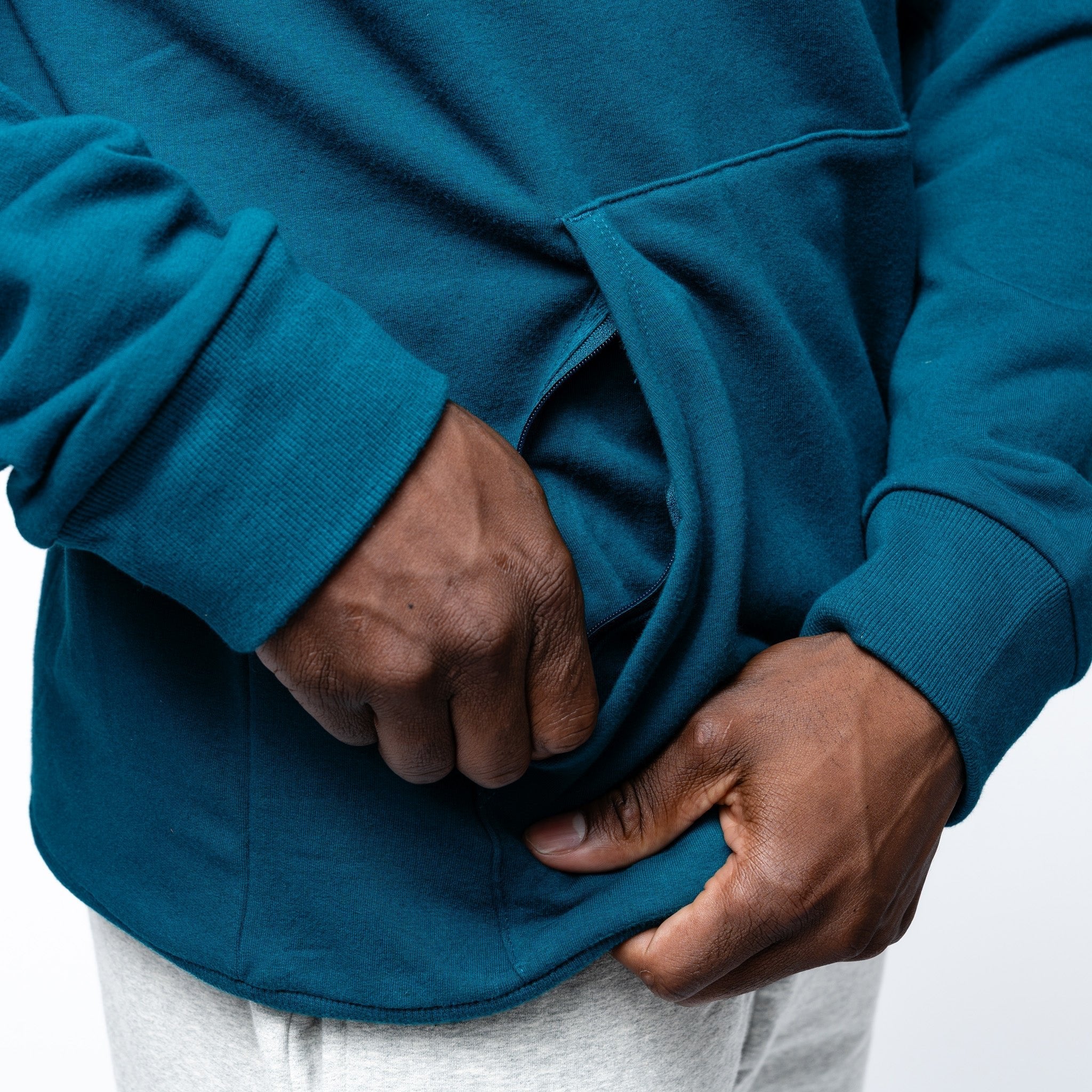 close up of the zippered pocket on the green Adult Seattle Torrent Royalty Heritage Cloud Hoodie