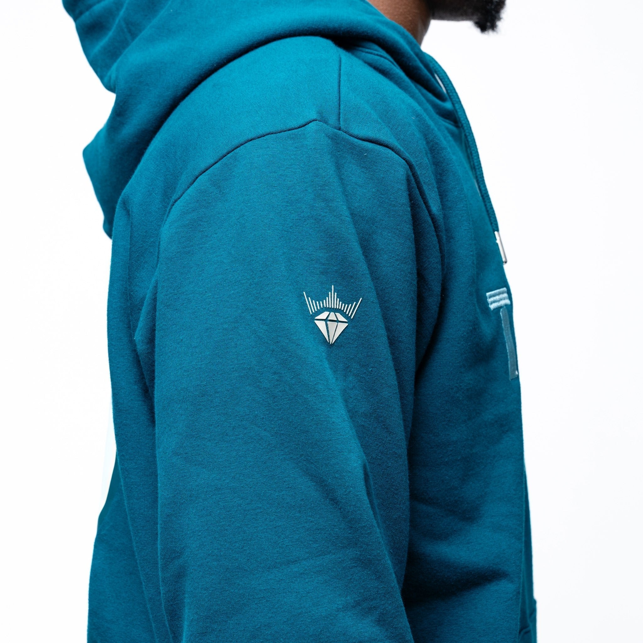 close up of arm of the green Adult Seattle Torrent Royalty Heritage Cloud Hoodie