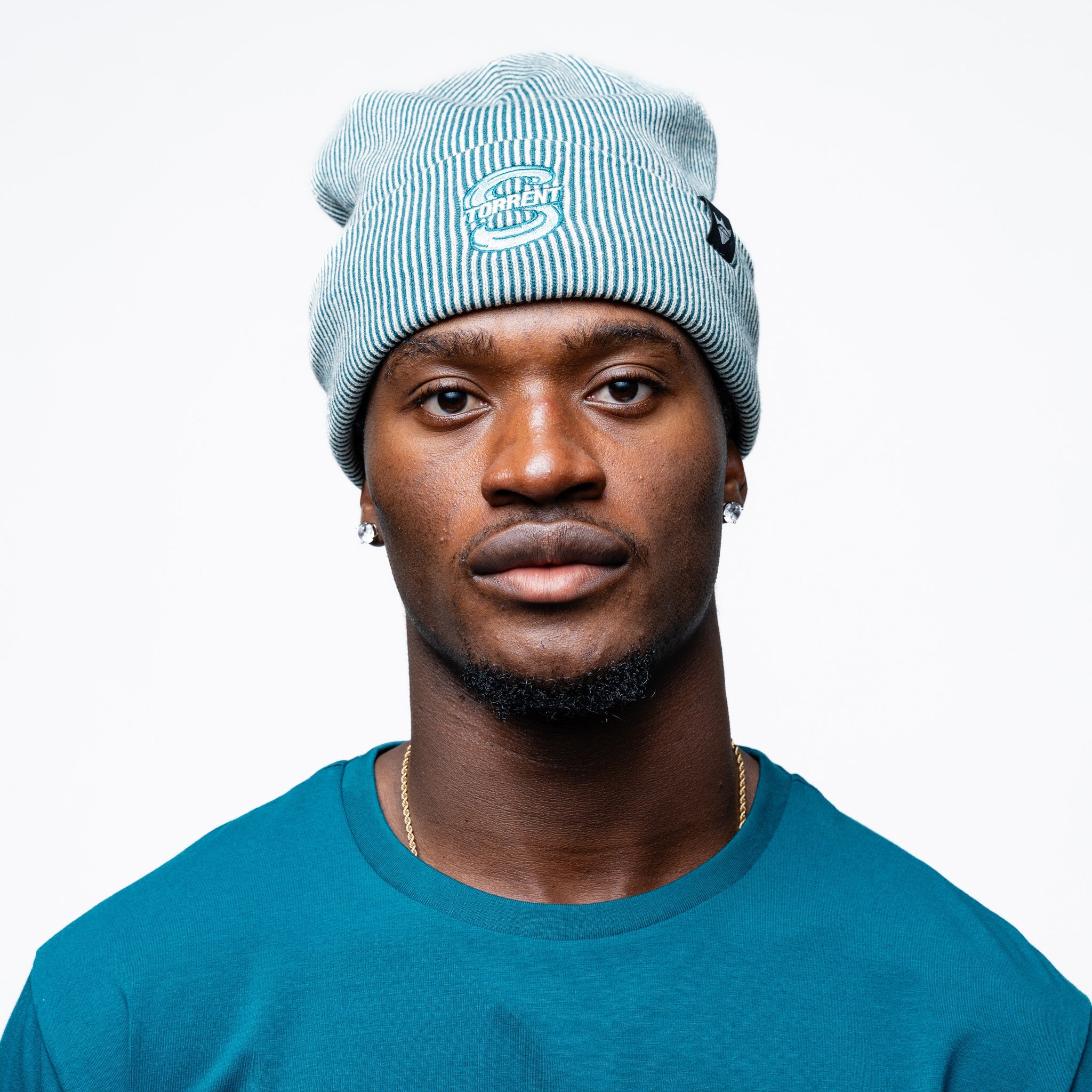 Man wearing the green Adult Seattle Torrent Royalty Double Knit Beanie