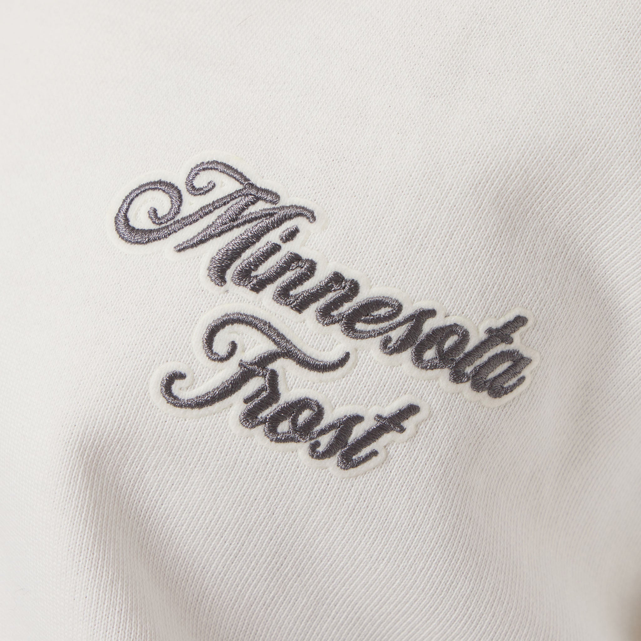 Embroidered text 'Minnesota Frost' on a white background