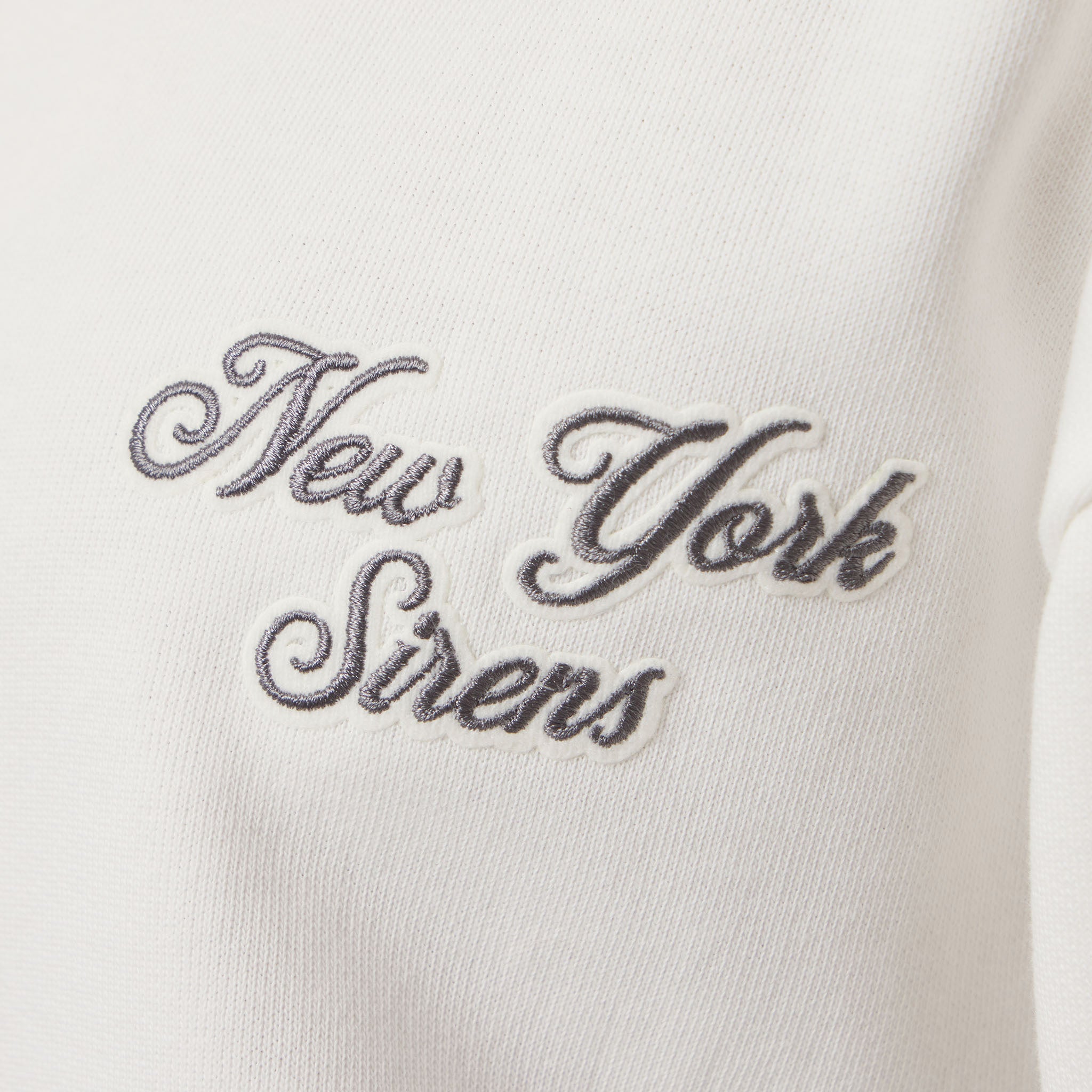 Embroidered text 'New York Sirens' on a white background