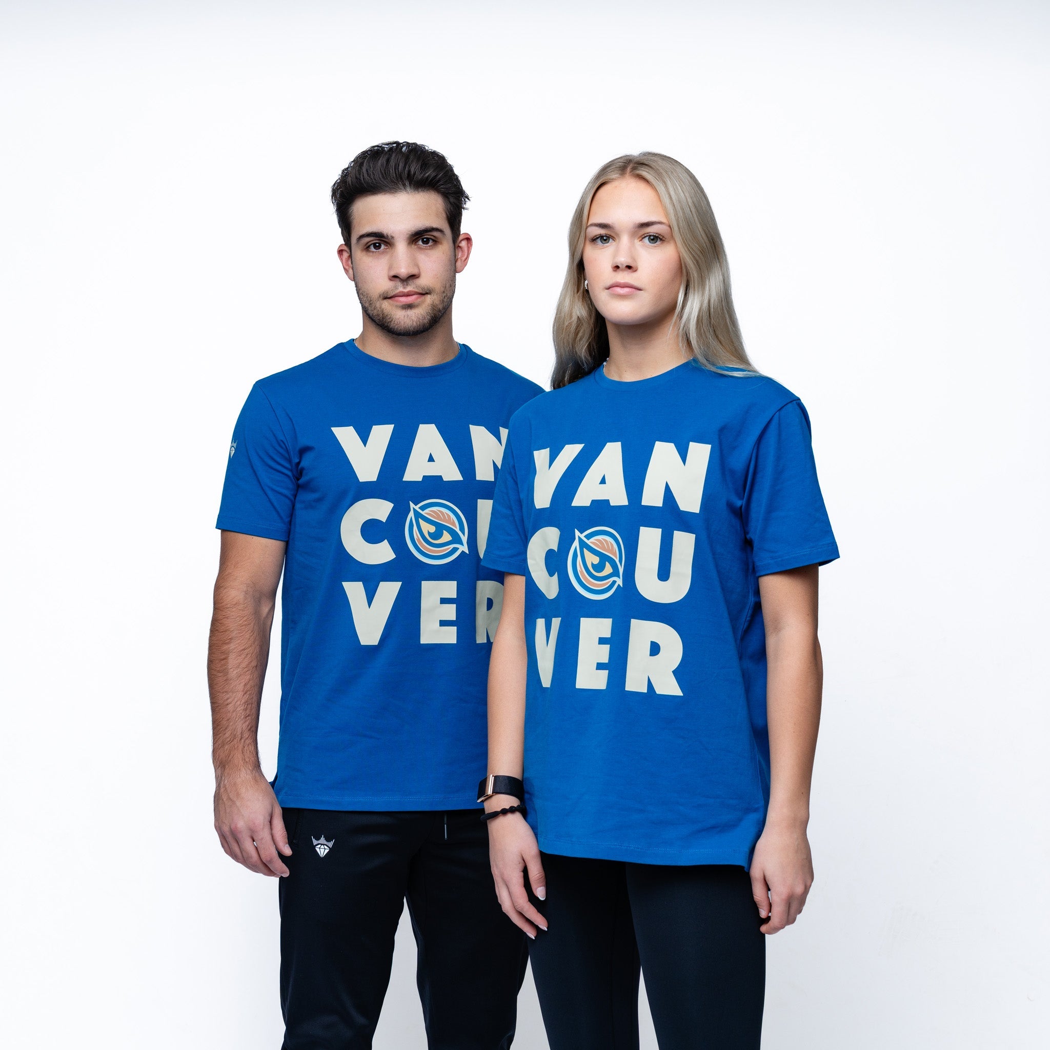 Man and woman wearing blue Adult Vancouver Goldeneyes Royalty Hometown Sideline T-Shirt