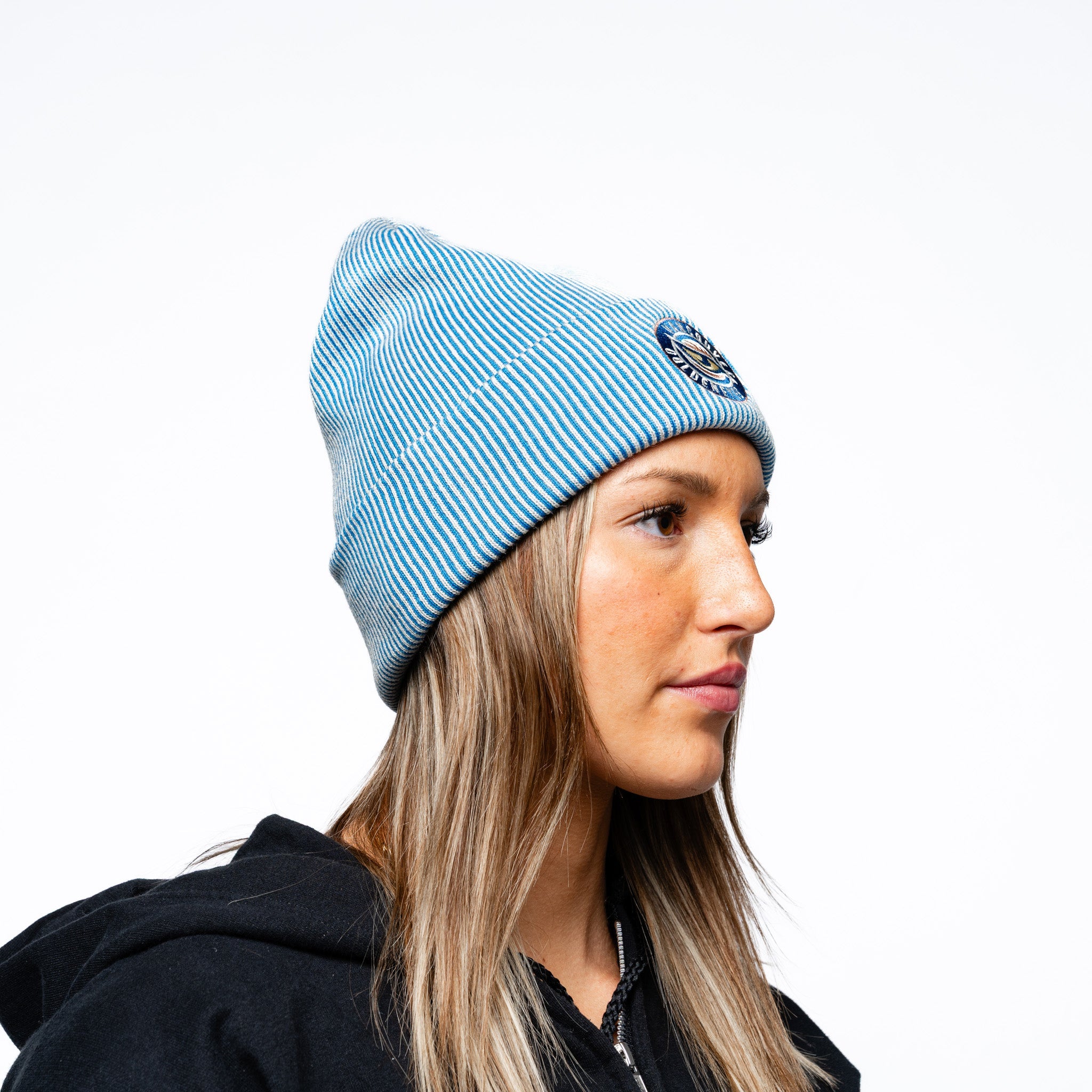 Woman wearing blue Adult Vancouver Goldeneyes Royalty Double Knit Beanie side angle