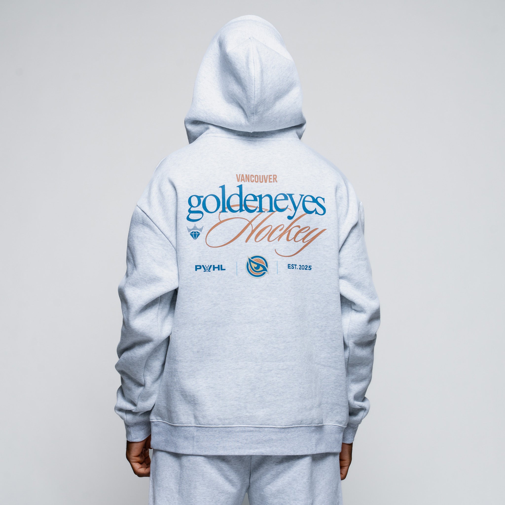 Gray hoodie with 'Vancouver Goldeneyes Hockey' text on the back against a gray background