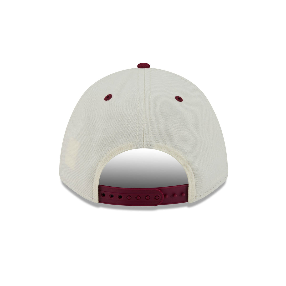 Back view of a baseball cap in off-white with burgundy details on the button, eyelets, and adjustable strap.