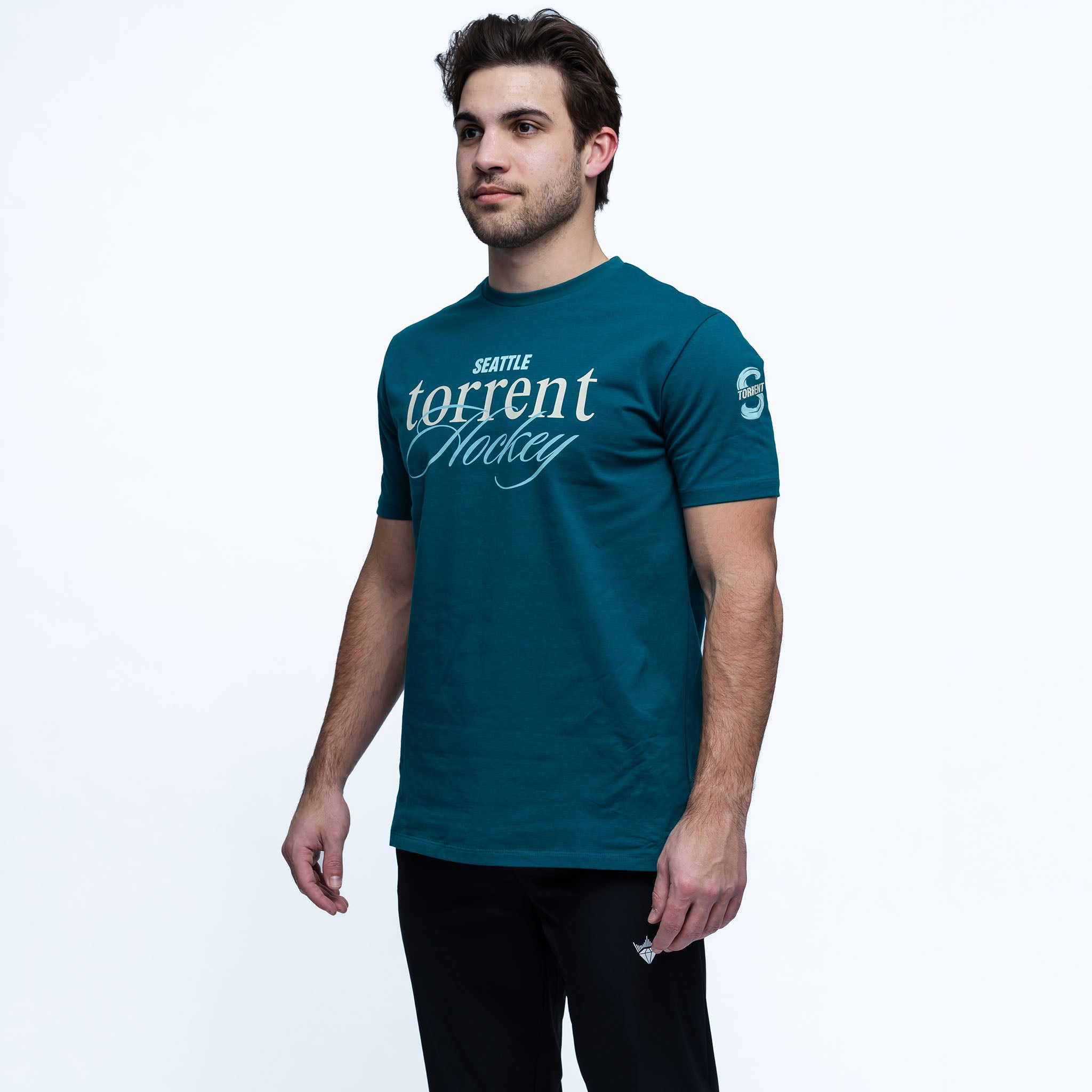 Man wearing a teal t-shirt with 'Seattle Torrent Hockey' text on a white background