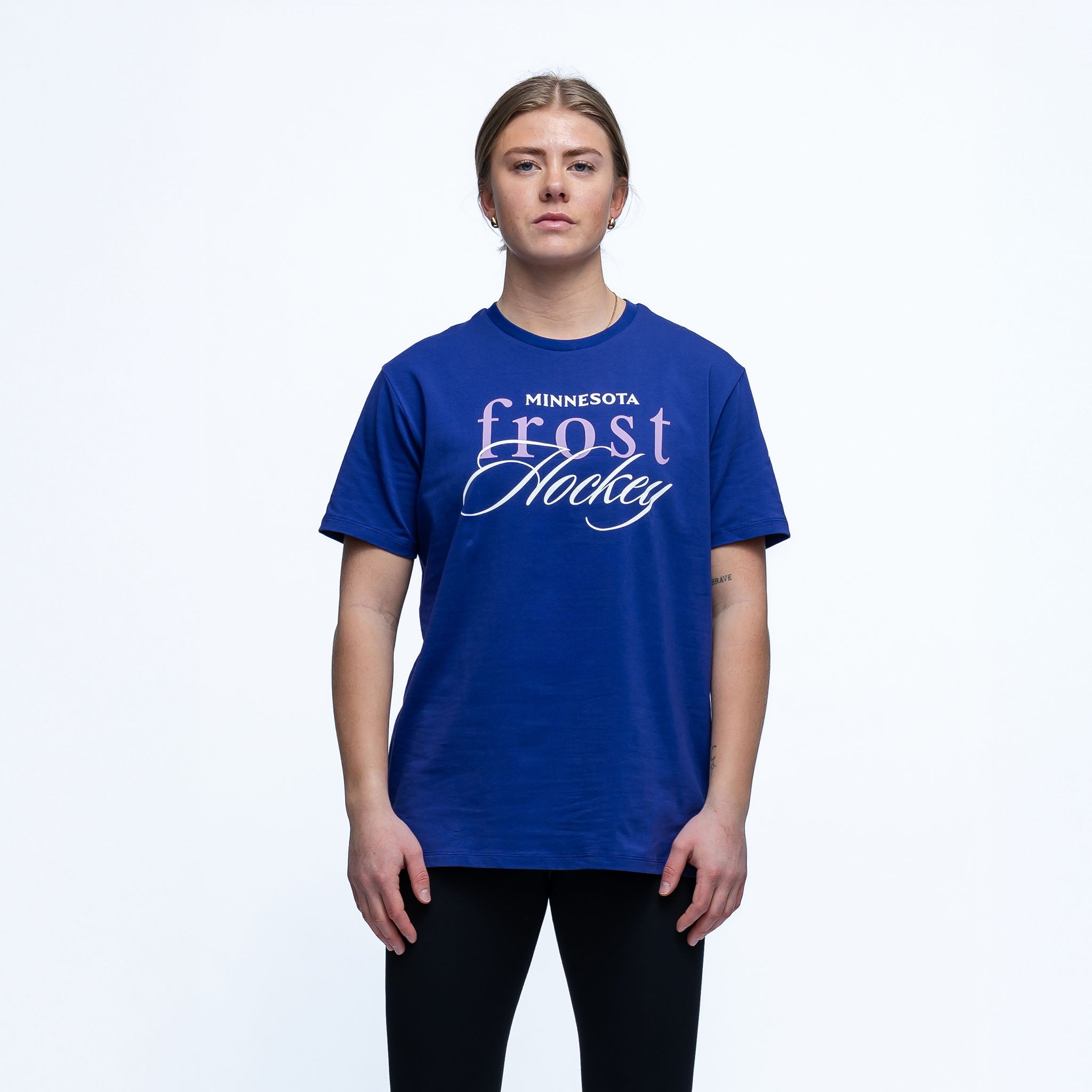 Person wearing a blue 'Minnesota Frost Hockey' t-shirt on a white background